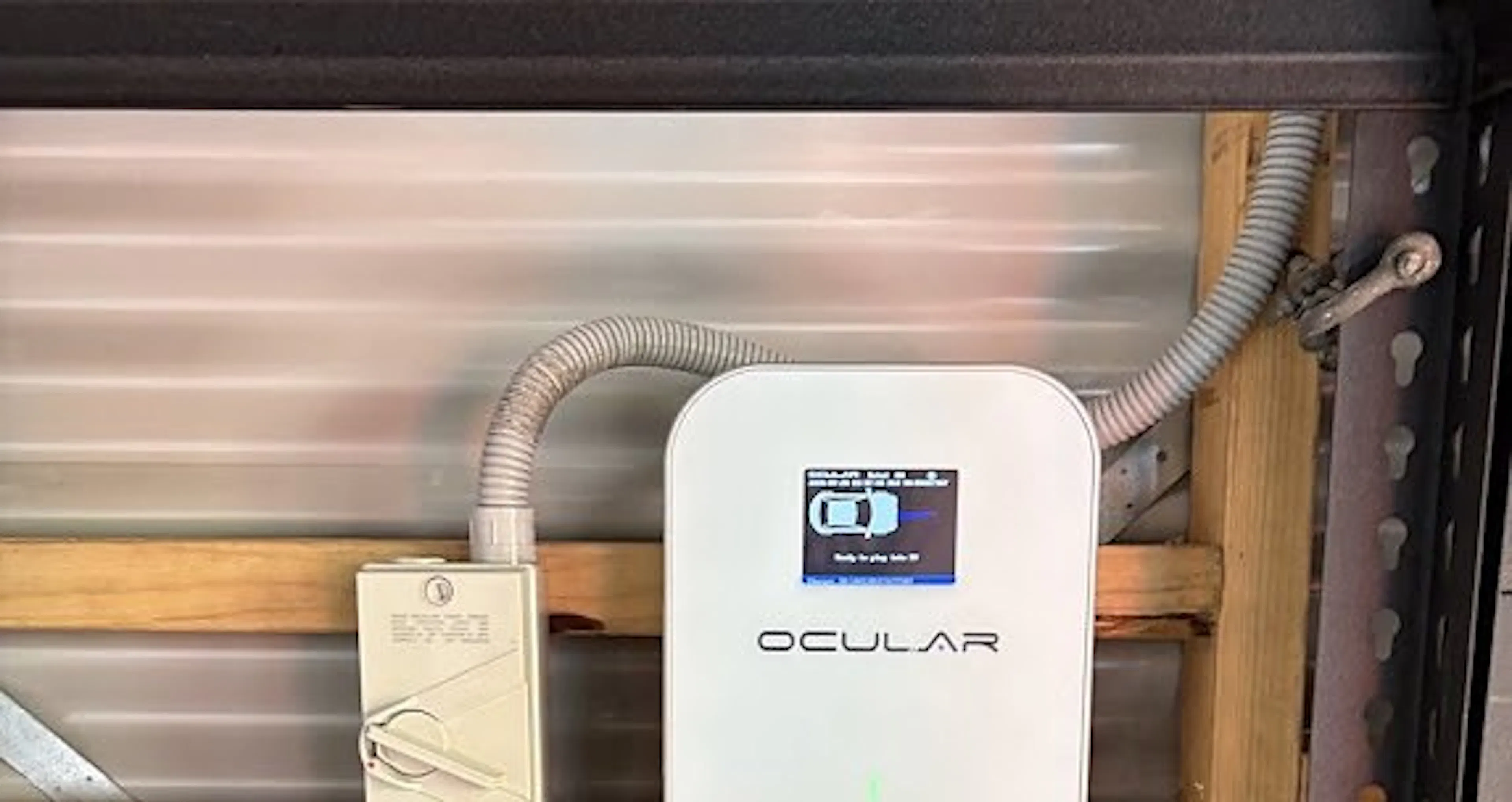 Three phase EV charger with an isolator and conduit in a Newtown garage, by Impulse Electrical Enterprise