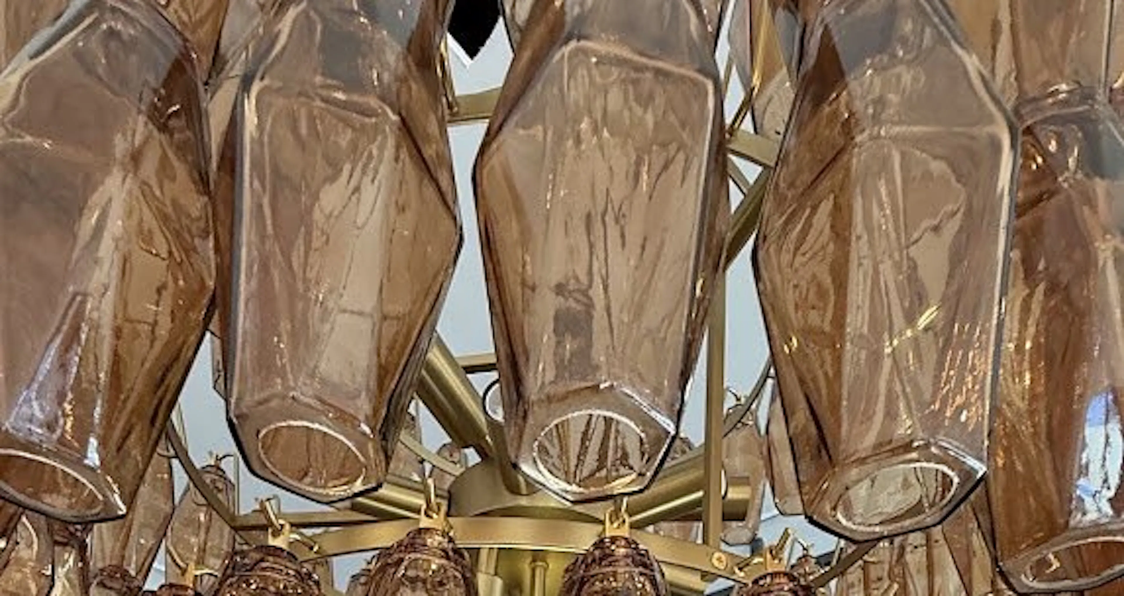 Close-up of an amber glass statement chandelier in Newtown, by Impulse Electrical Enterprise