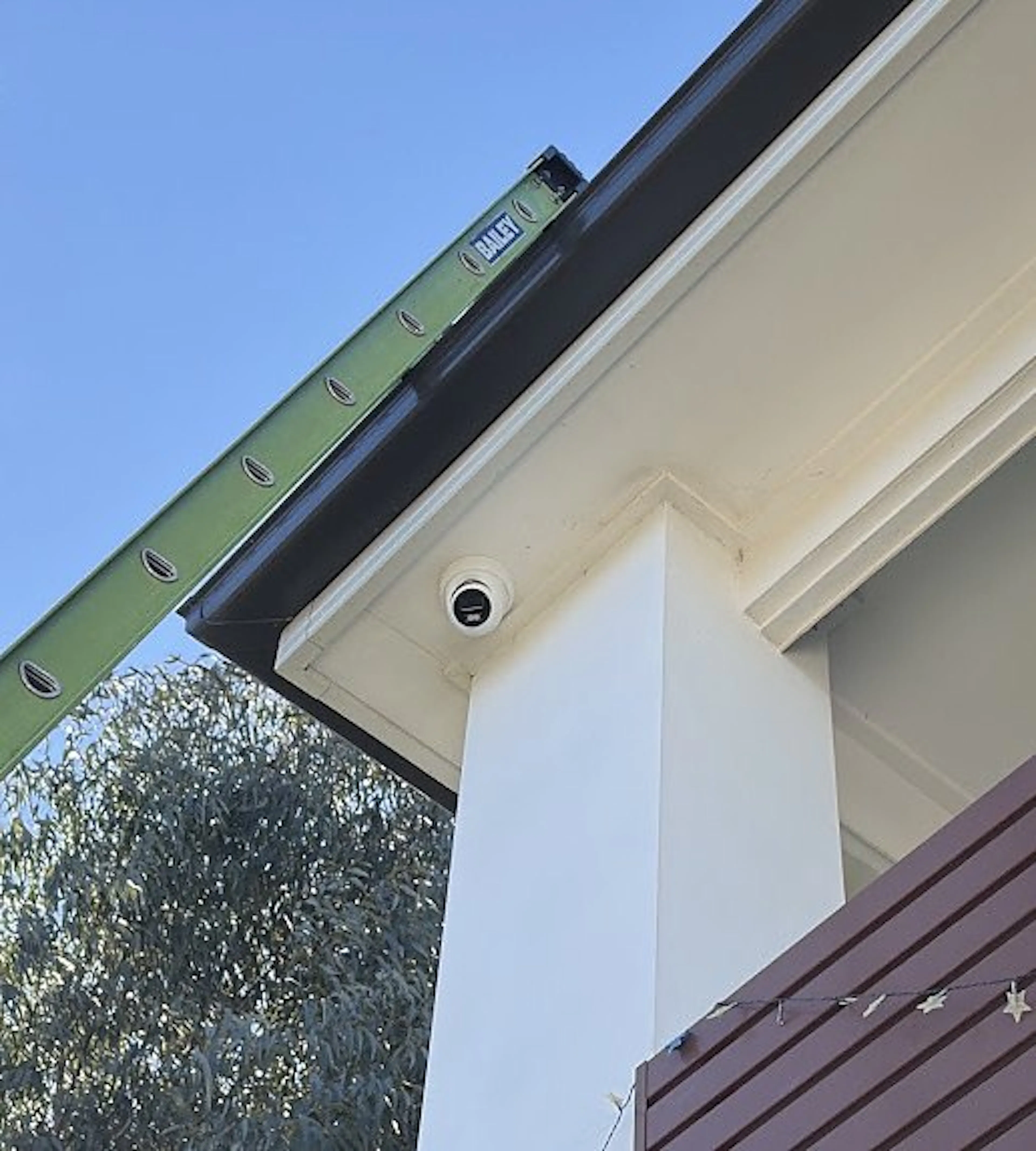 Turret camera under the eave of a Riverstone home, by Impulse Electrical Enterprise