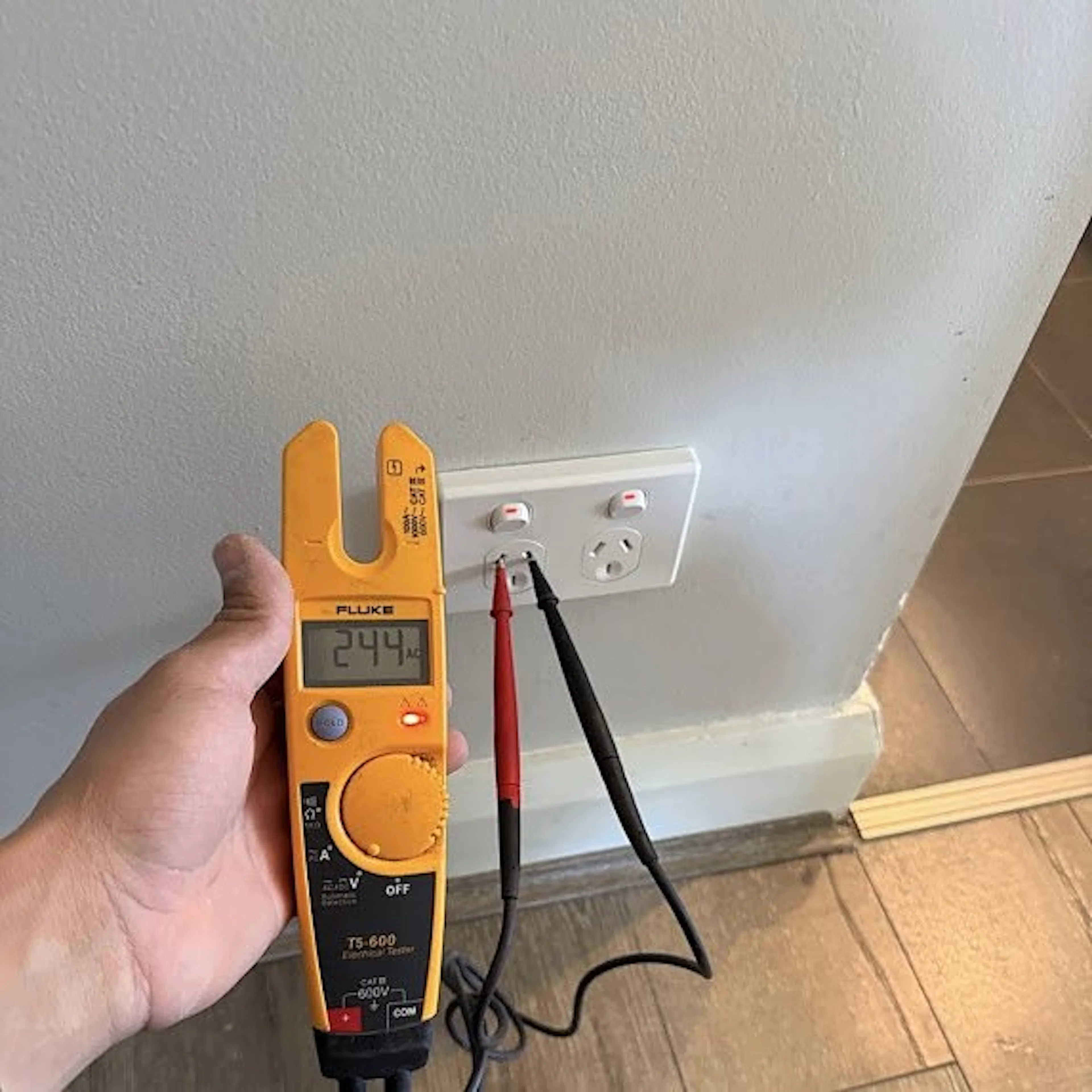 Electrician testing a new double power point, by Impulse Electrical Enterprise