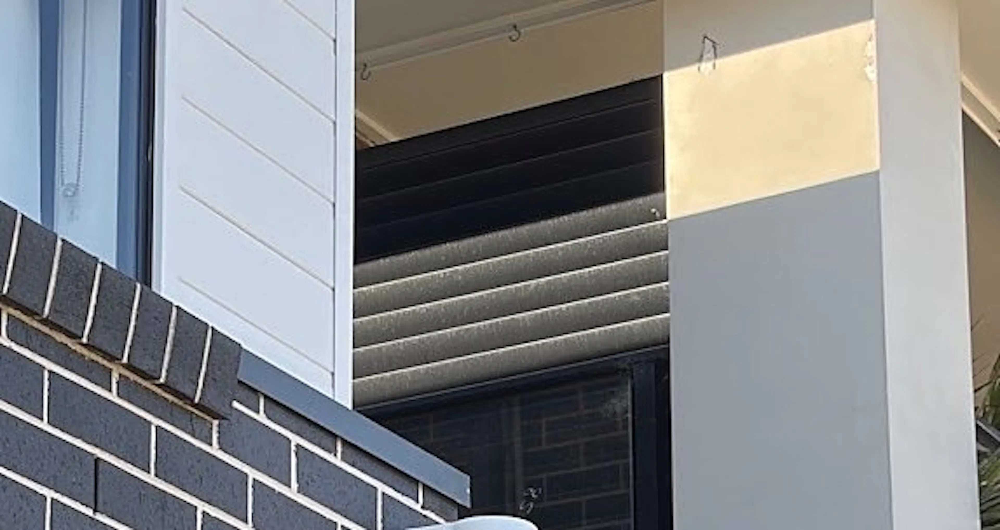 Hikvision turret camera on a bracket at the corner of a brick wall in Riverstone, by Impulse Electrical Enterprise
