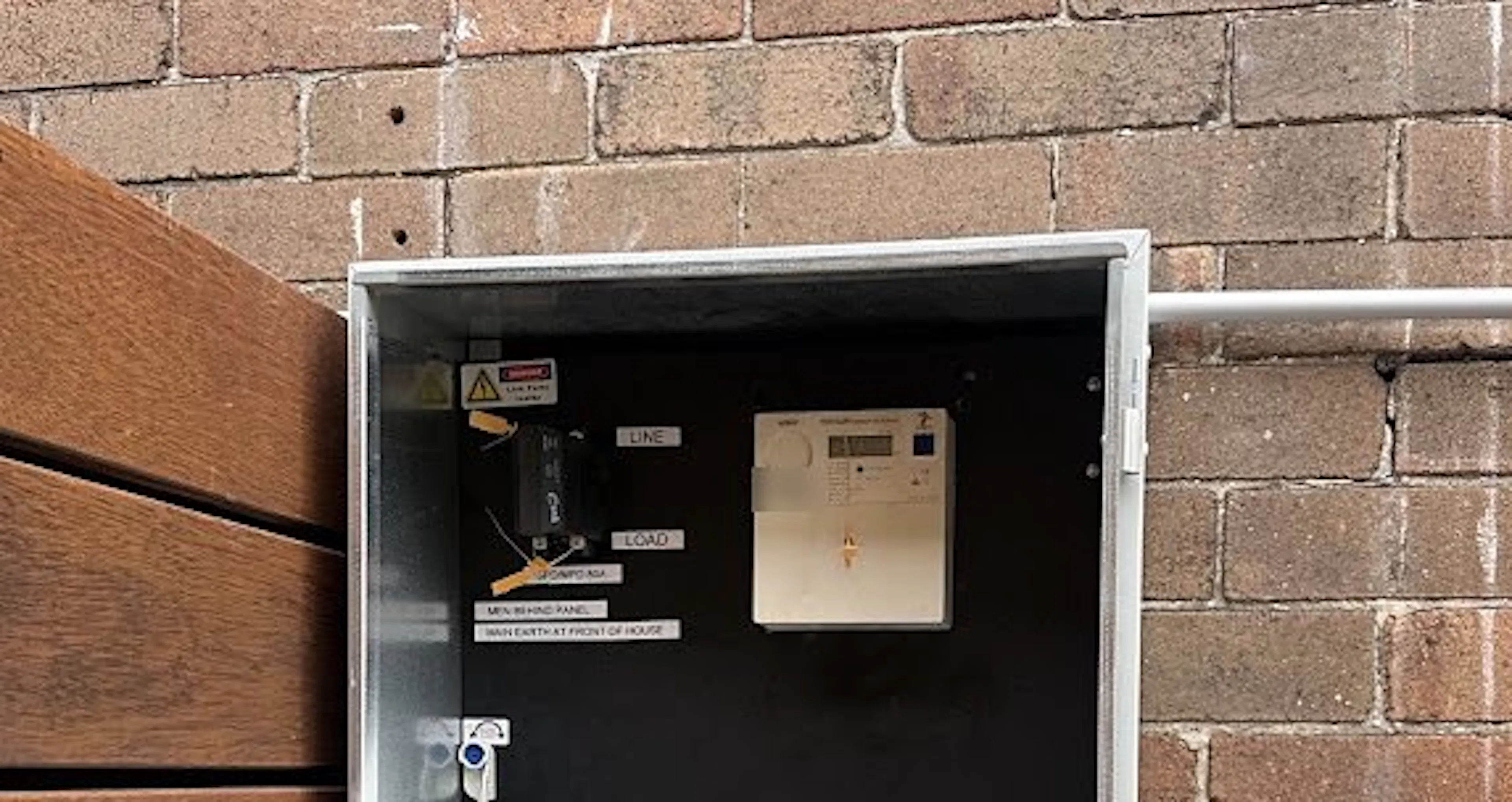 Upgraded switchboard in its new position on a brick wall in Leichhardt, by Impulse Electrical Enterprise