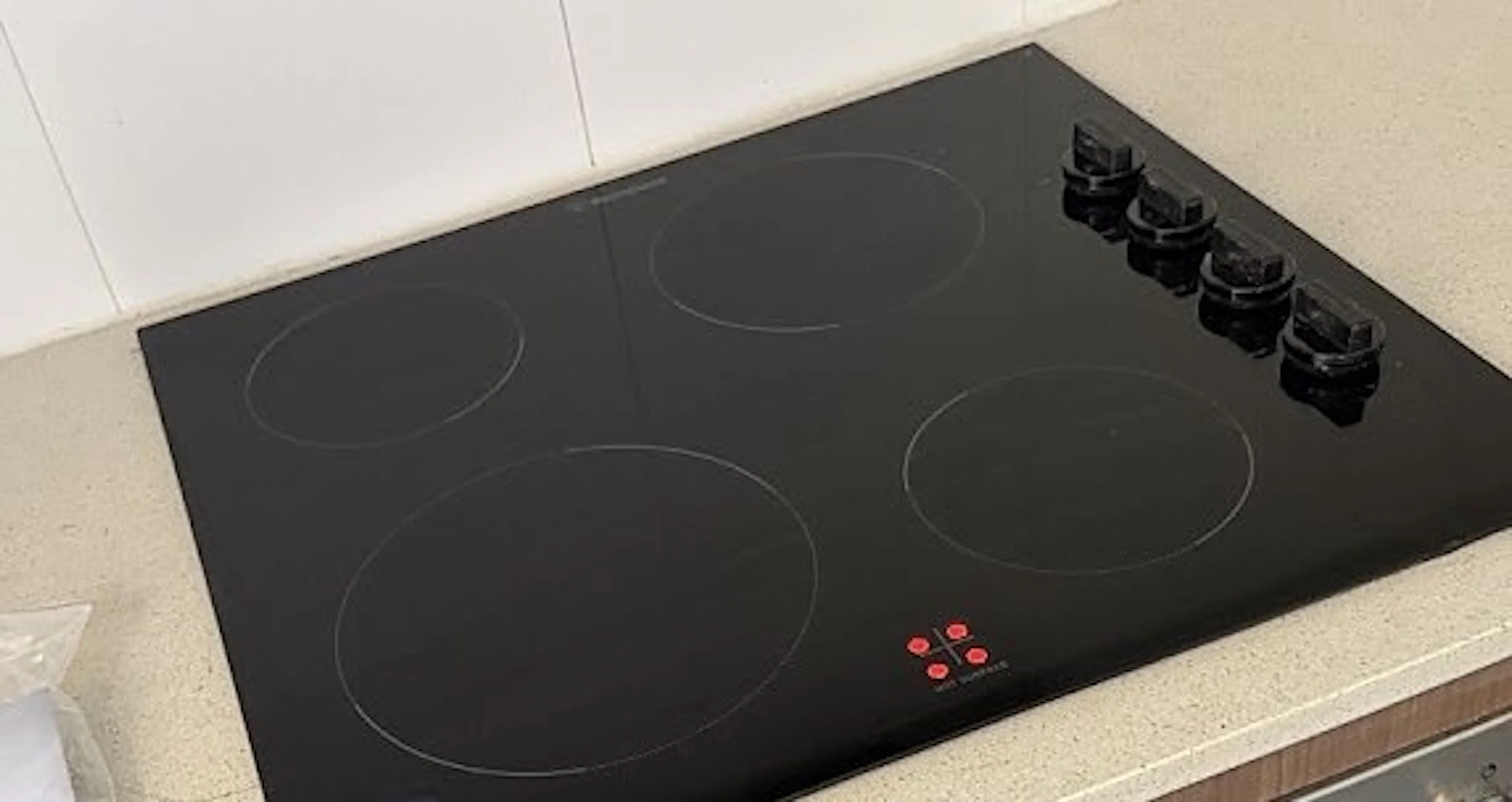 New ceramic cooktop above an oven in a Homebush kitchen, by Impulse Electrical Enterprise