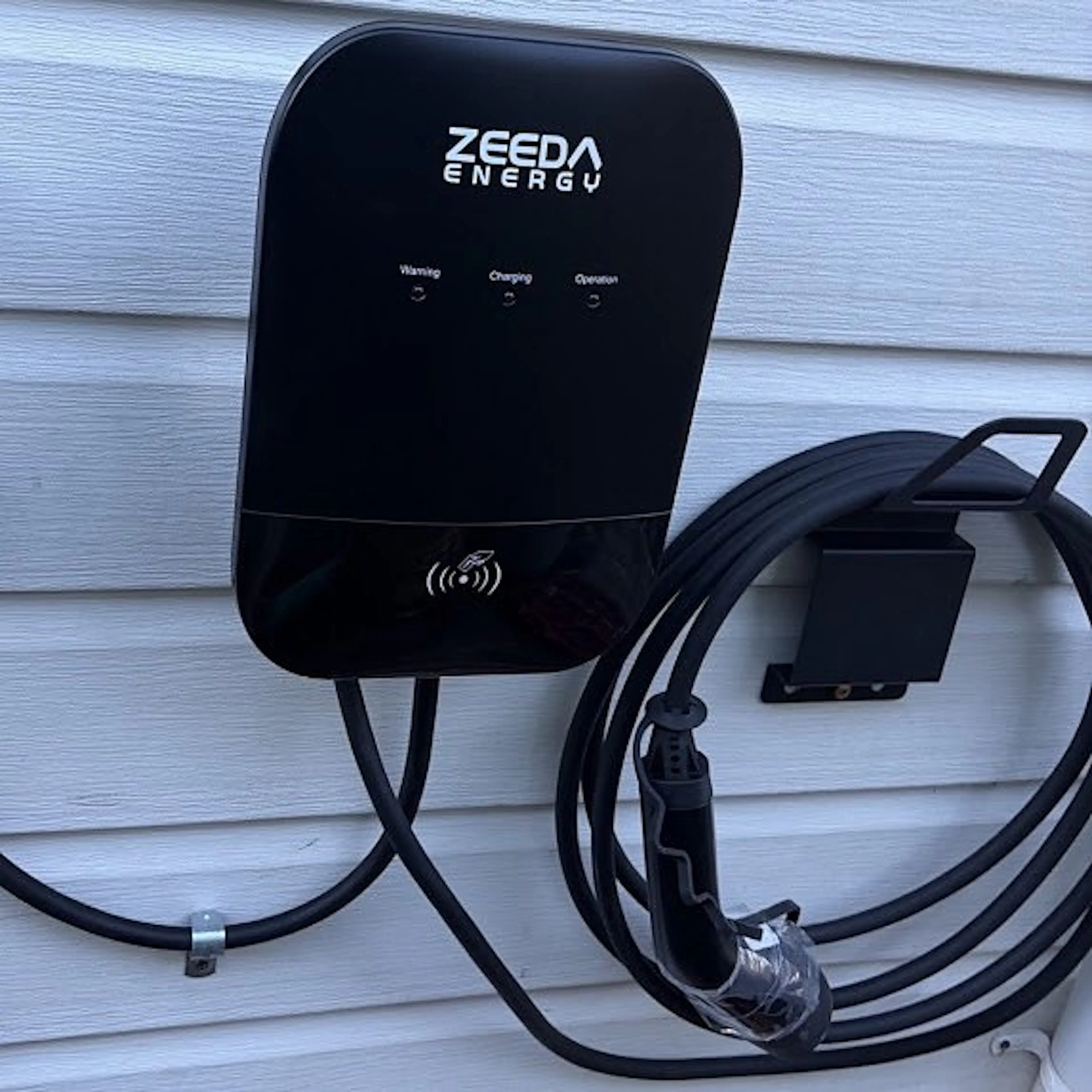 Close-up of a home EV charger with its cable holder, by Impulse Electrical Enterprise