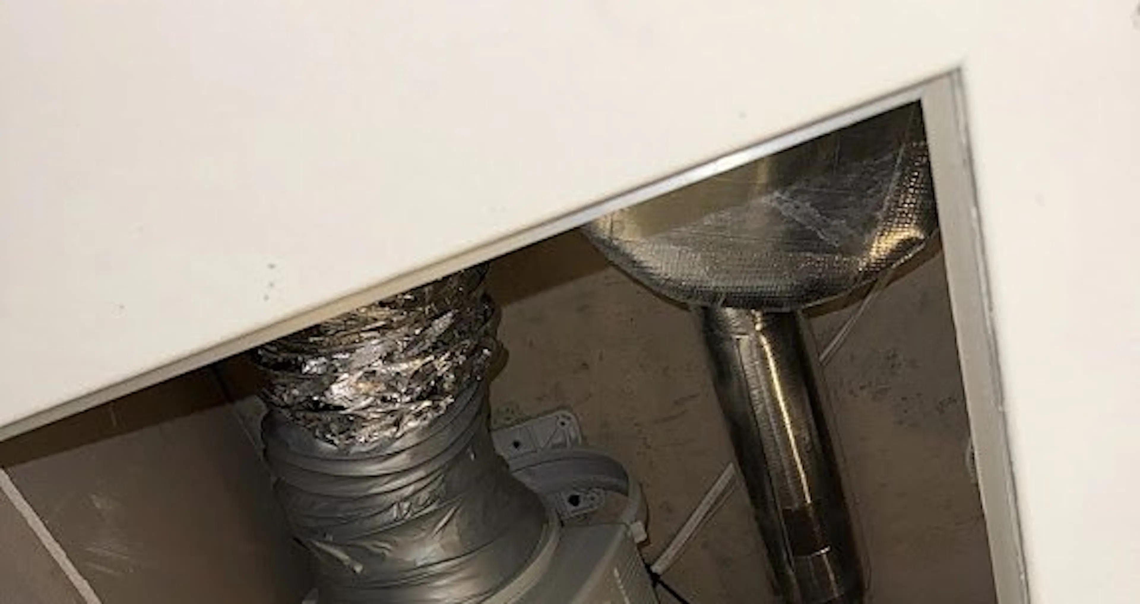New inline exhaust fan and ducting in the ceiling space of a Sydney Olympic Park home, by Impulse Electrical Enterprise