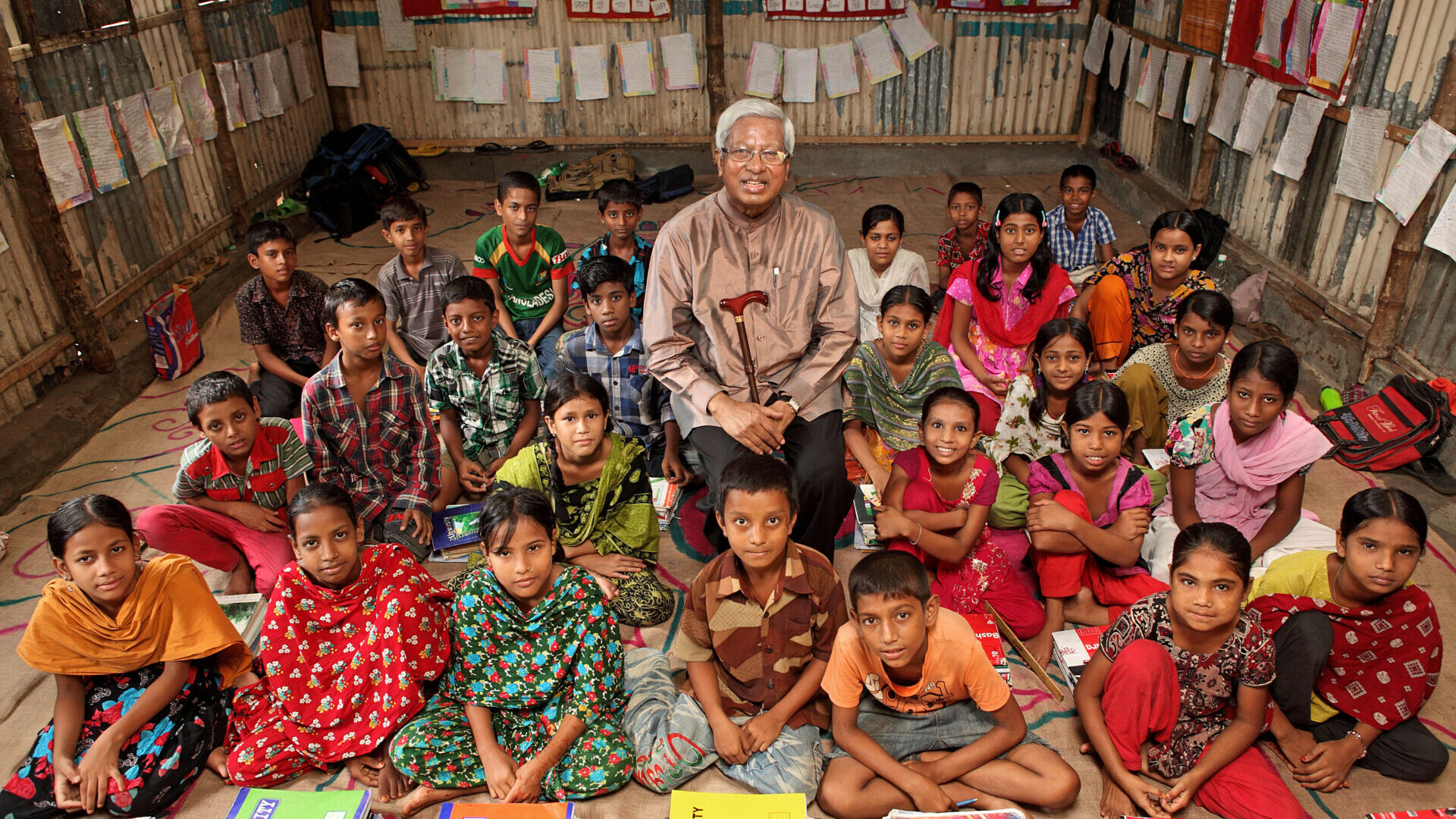 man and his students in Bangladesh