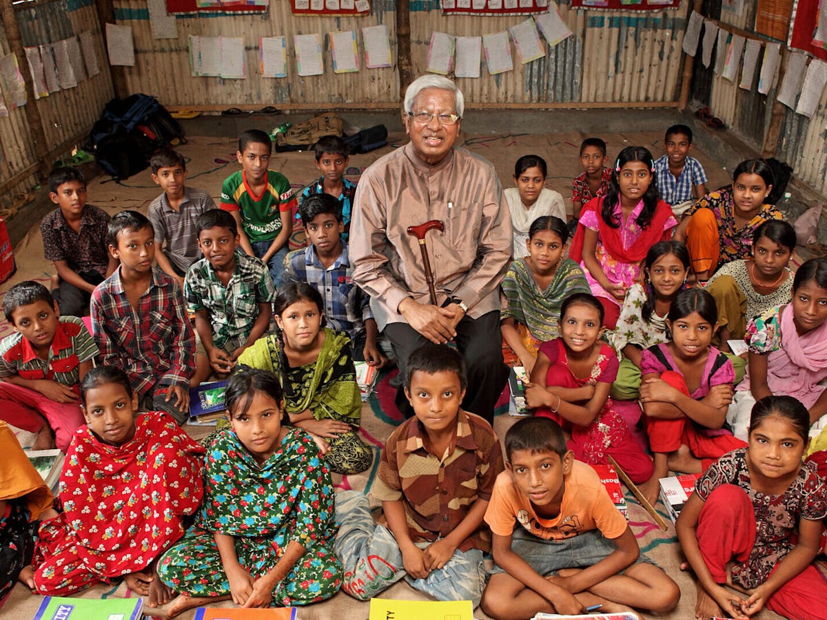man and his students in Bangladesh