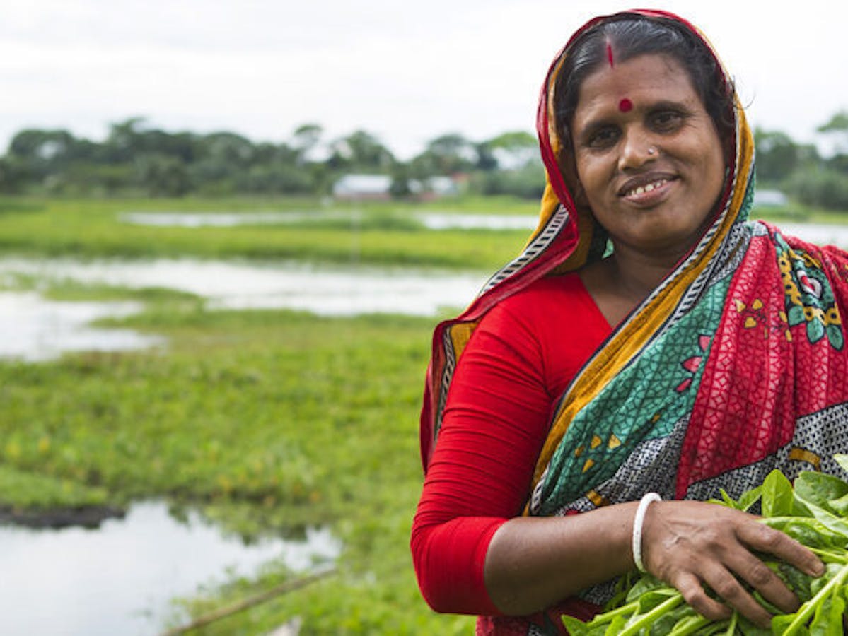 woman in a farm holding crops