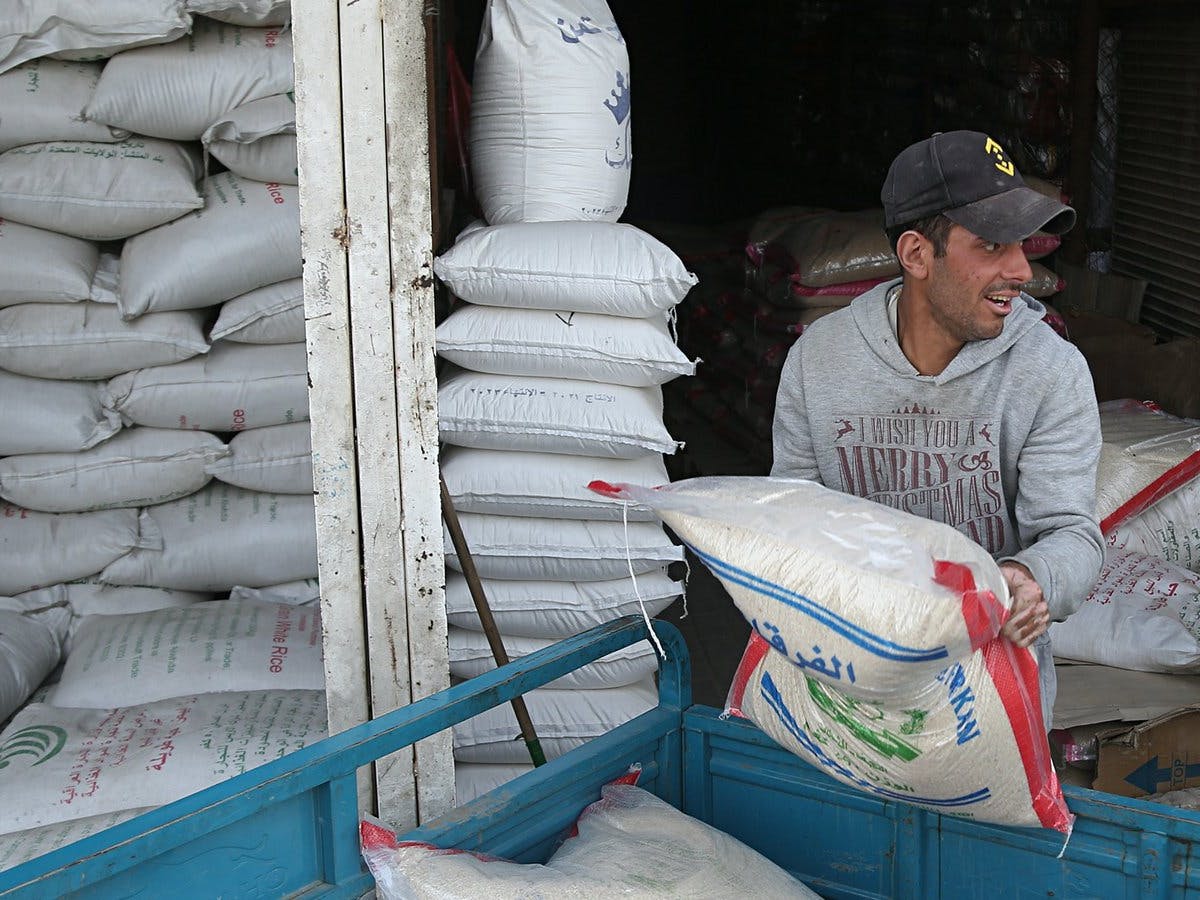 man loading food into truck in Ukraine