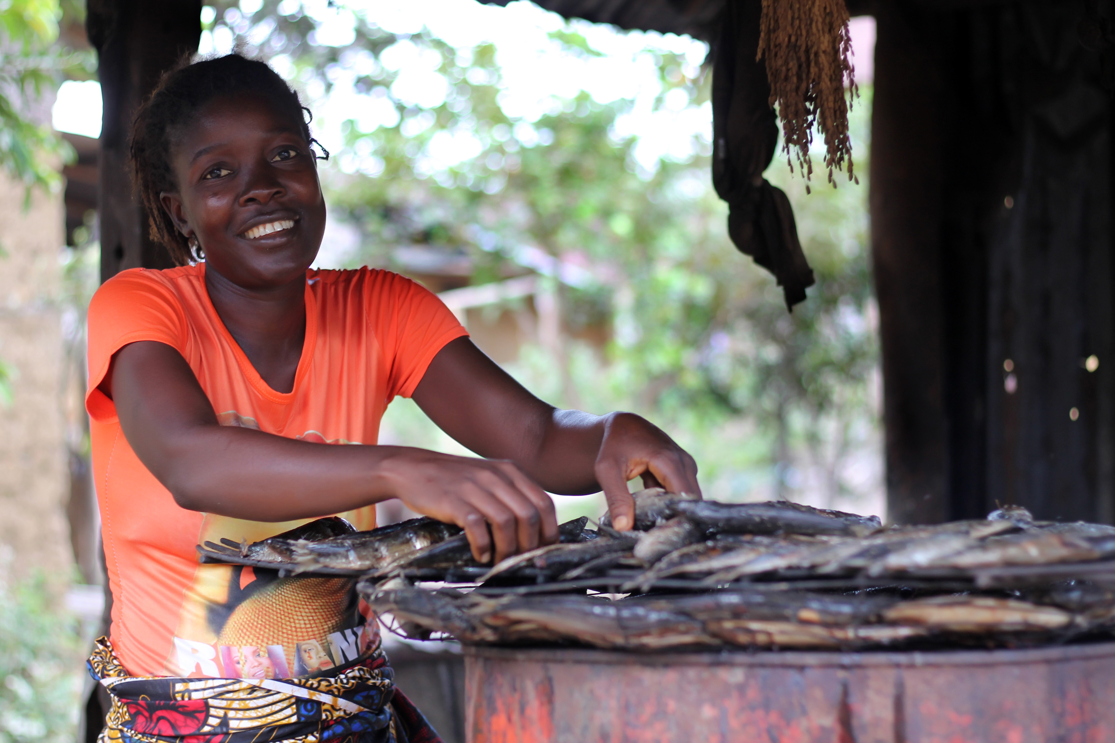 woman sitting at table in Liberia. 