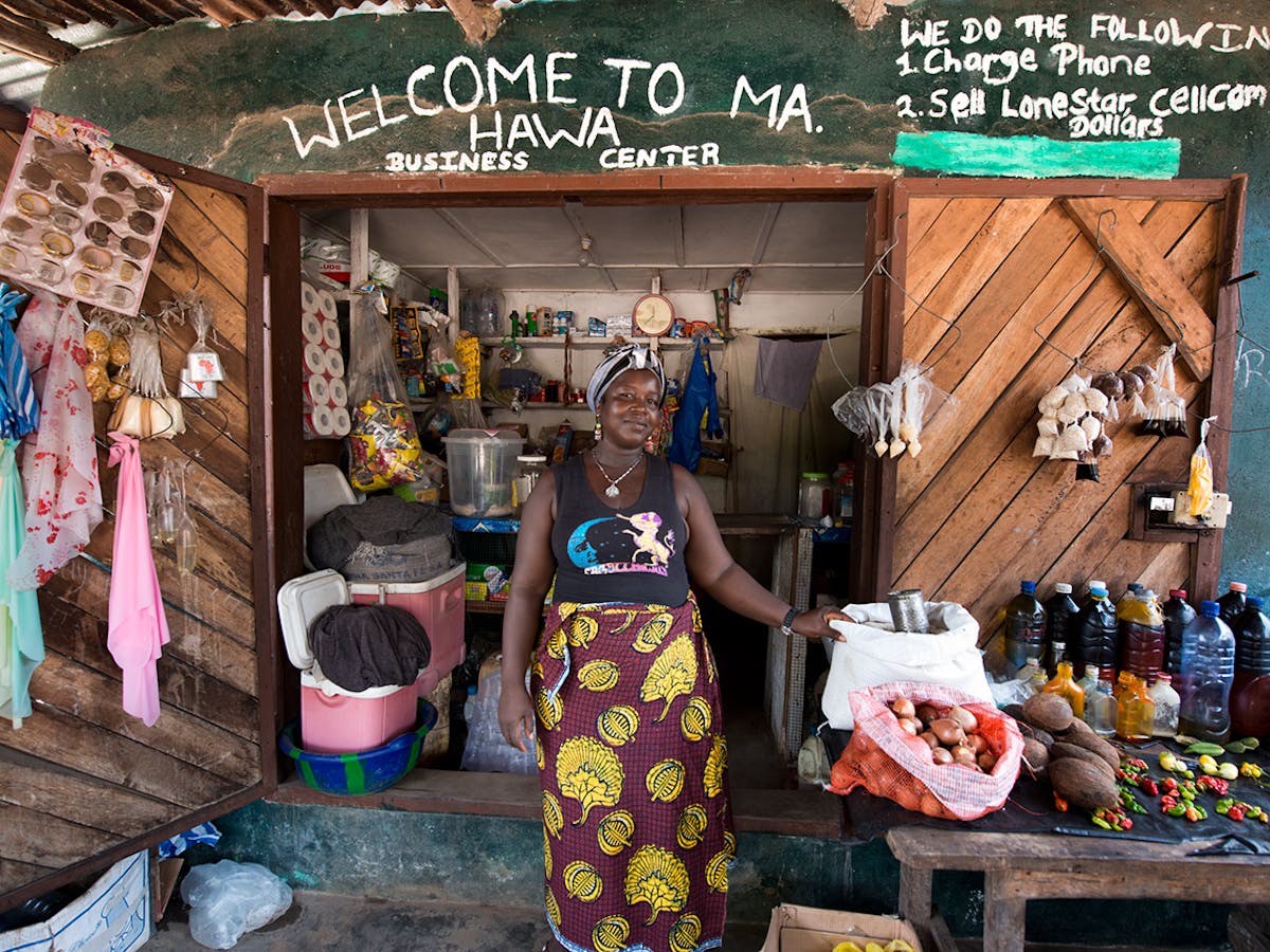 woman selling wares from her shop