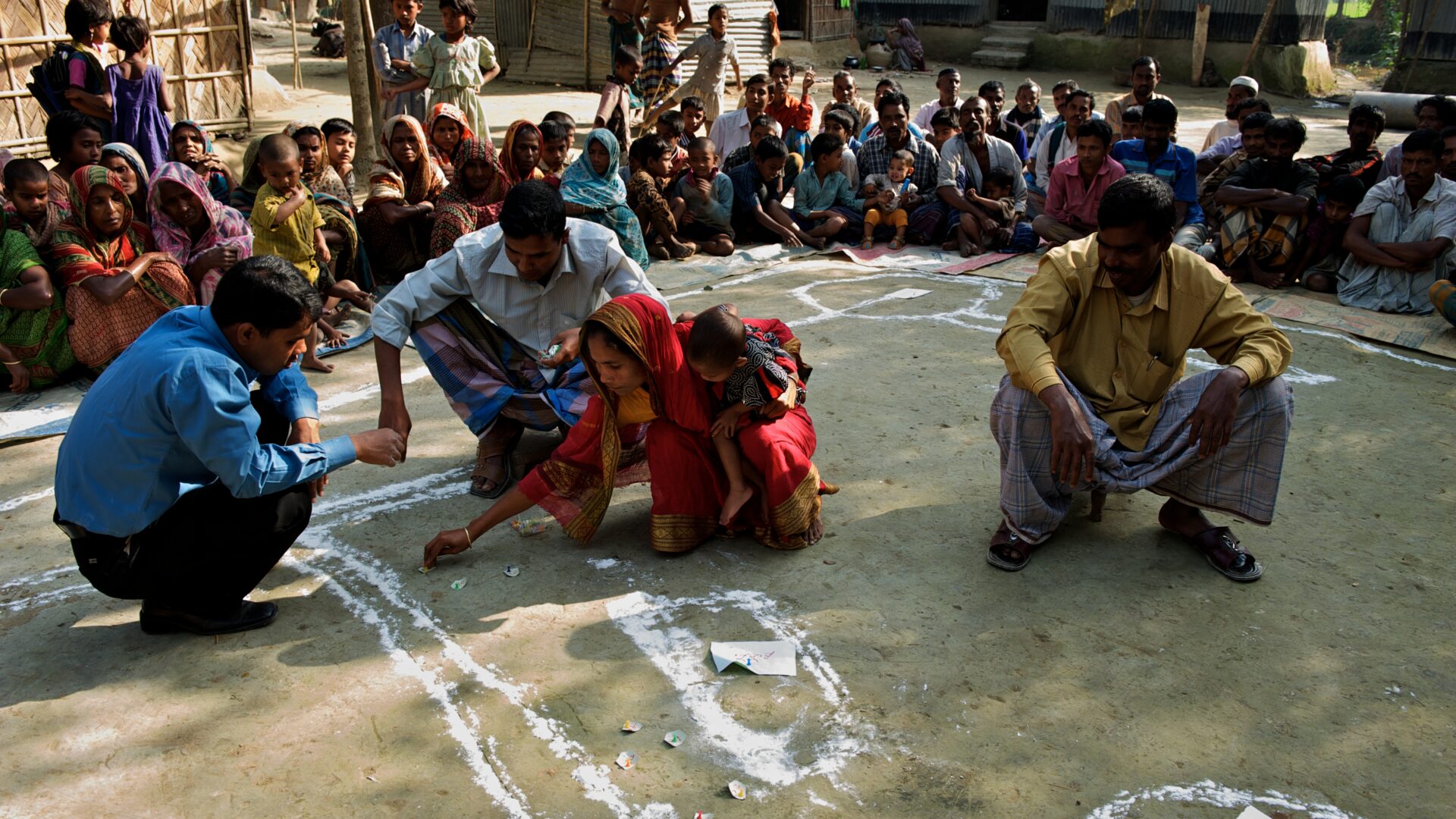 members of community together using chalk outside