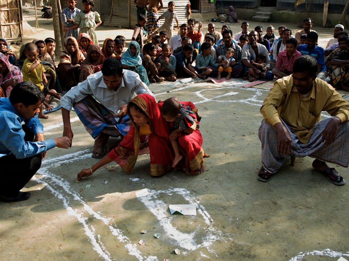 members of community together using chalk outside