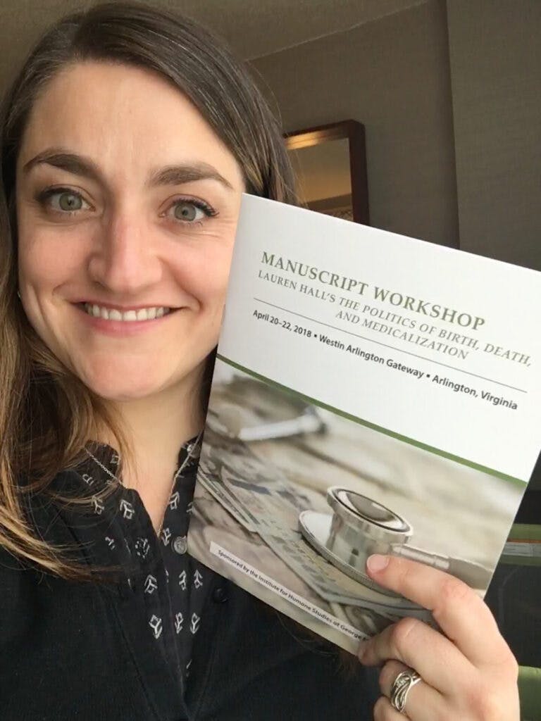 Lauren with a manuscript she presented at an IHS workshop