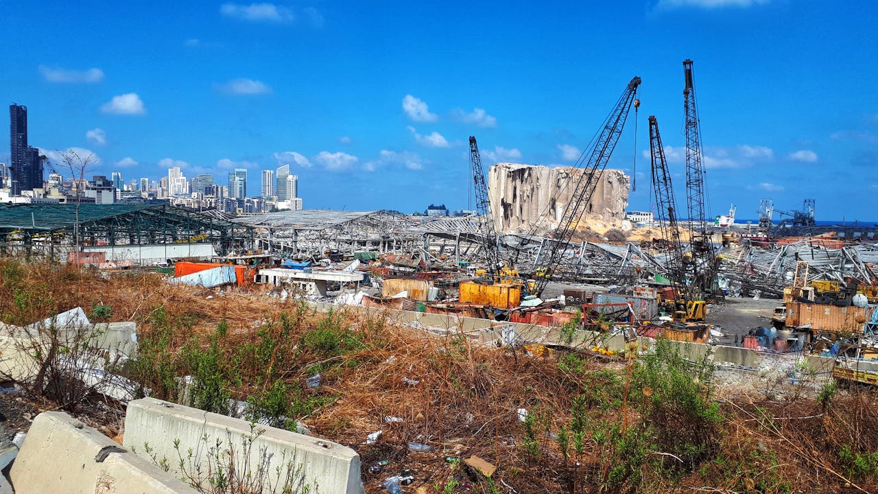 Mangled metal structures of buildings show the impact of the explosion at the Beirut port.