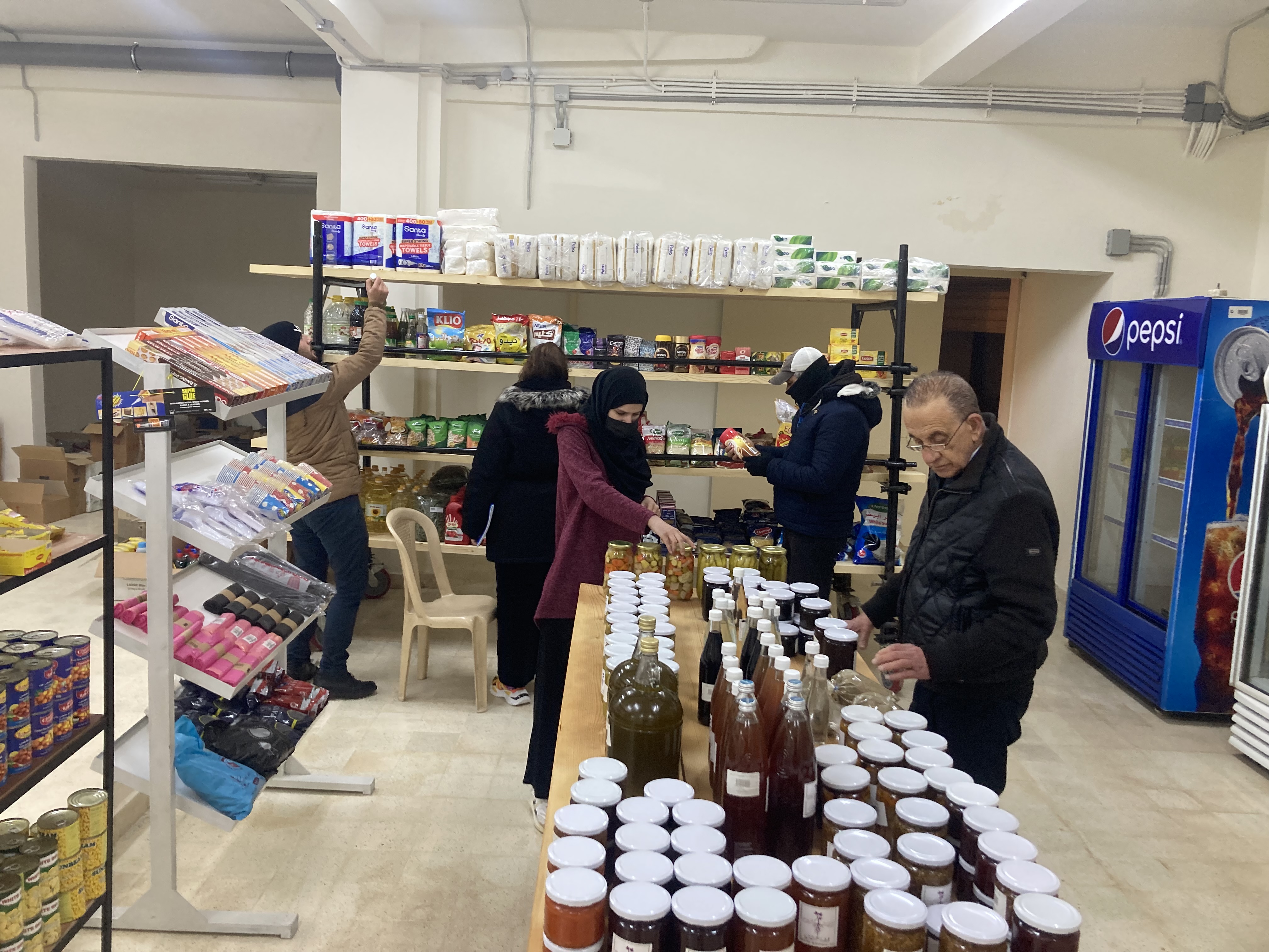 Customers browse the shelves at Dikkeneh consumer cooperative grocery store in Beirut, Lebanon.