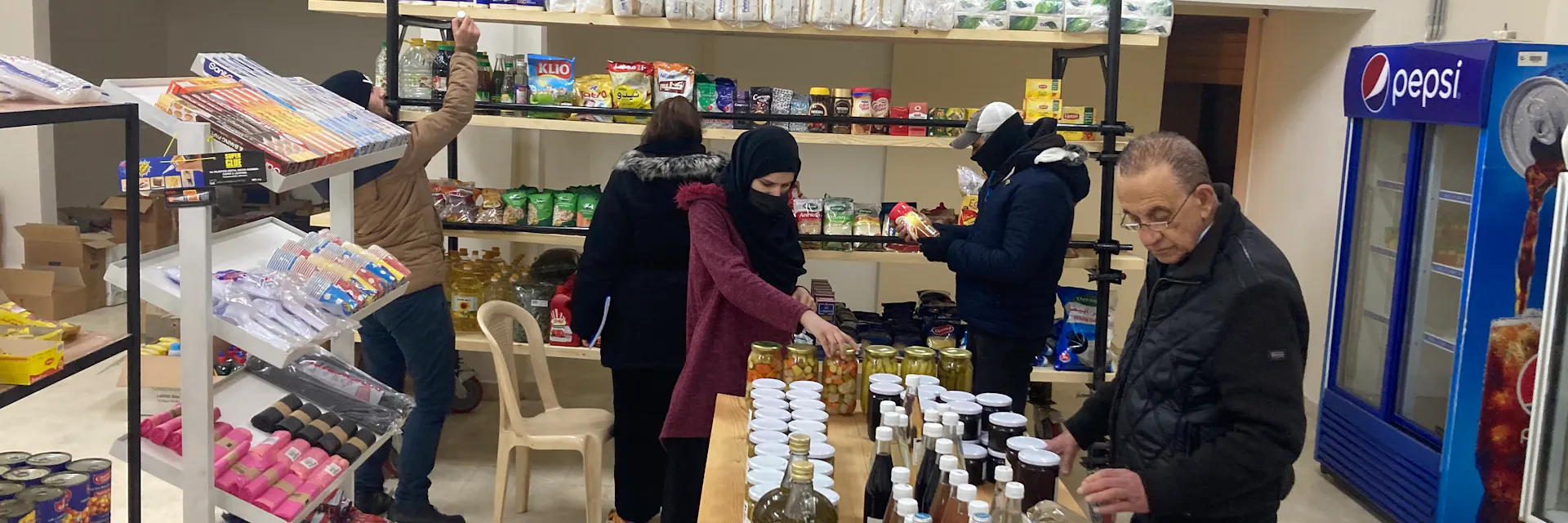Customers browse the shelves at Dikkeneh consumer cooperative grocery store in Beirut, Lebanon.