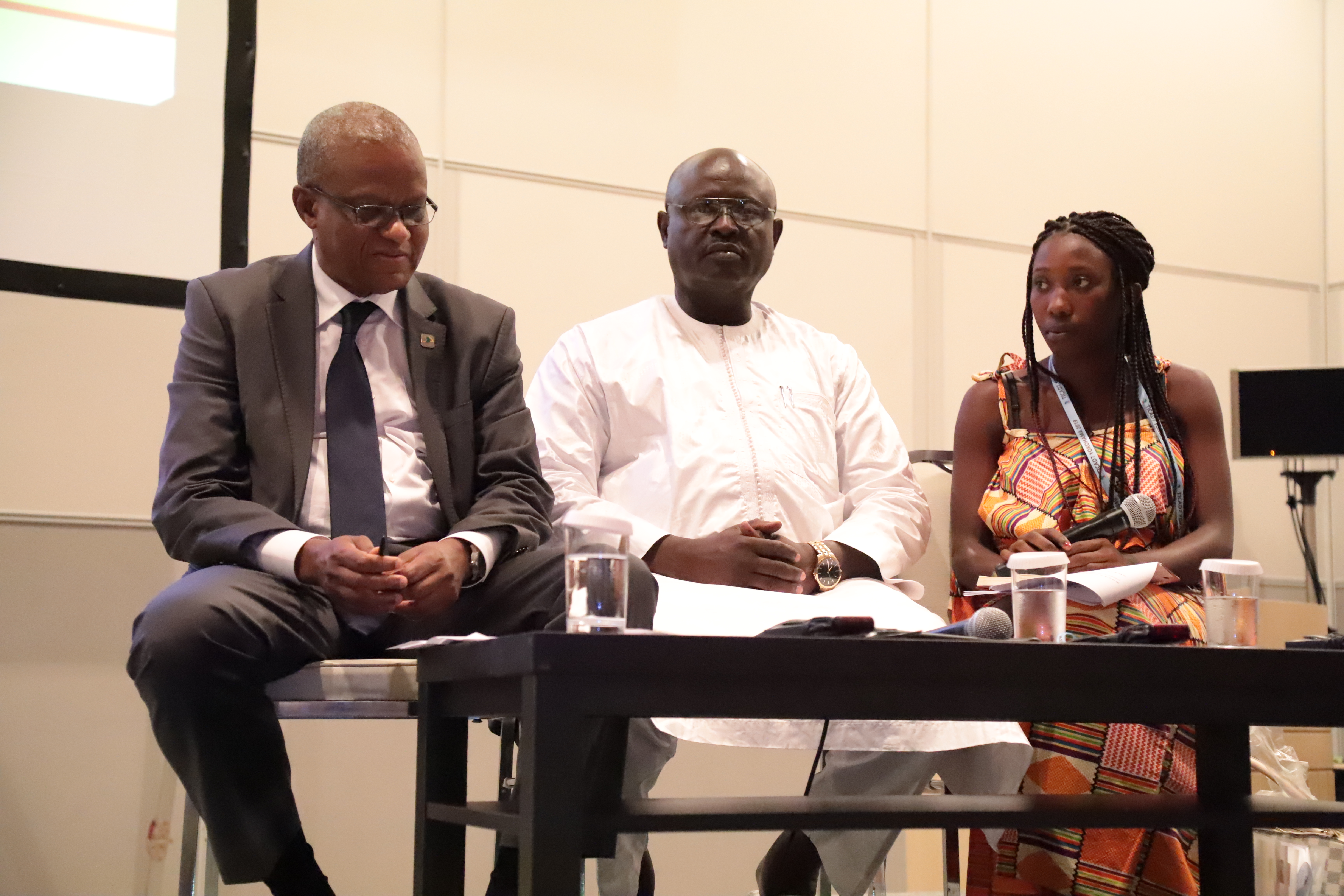 Sainabou Jammeh is seated with two other guests at the 2019 Tokyo International Conference on African Development.