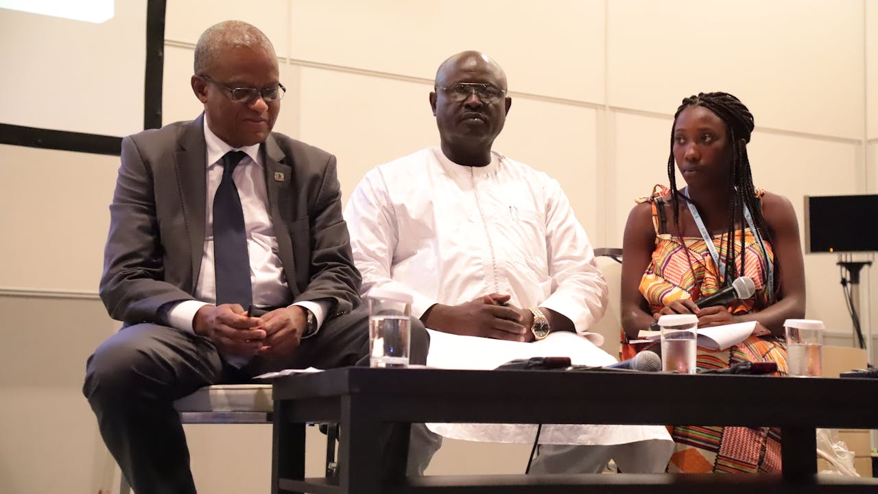Sainabou Jammeh is seated with two other guests at the 2019 Tokyo International Conference on African Development.
