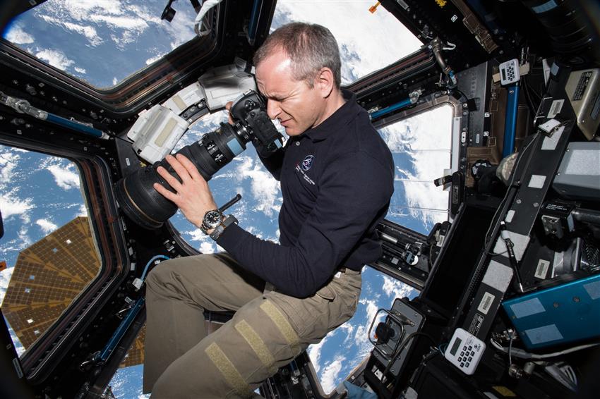 Astronaut David Saint-Jacques takes a picture through a window in the Cupola of the International Space Station