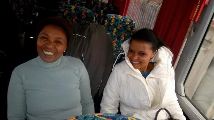 Myriam and her daughter sit in a train.
