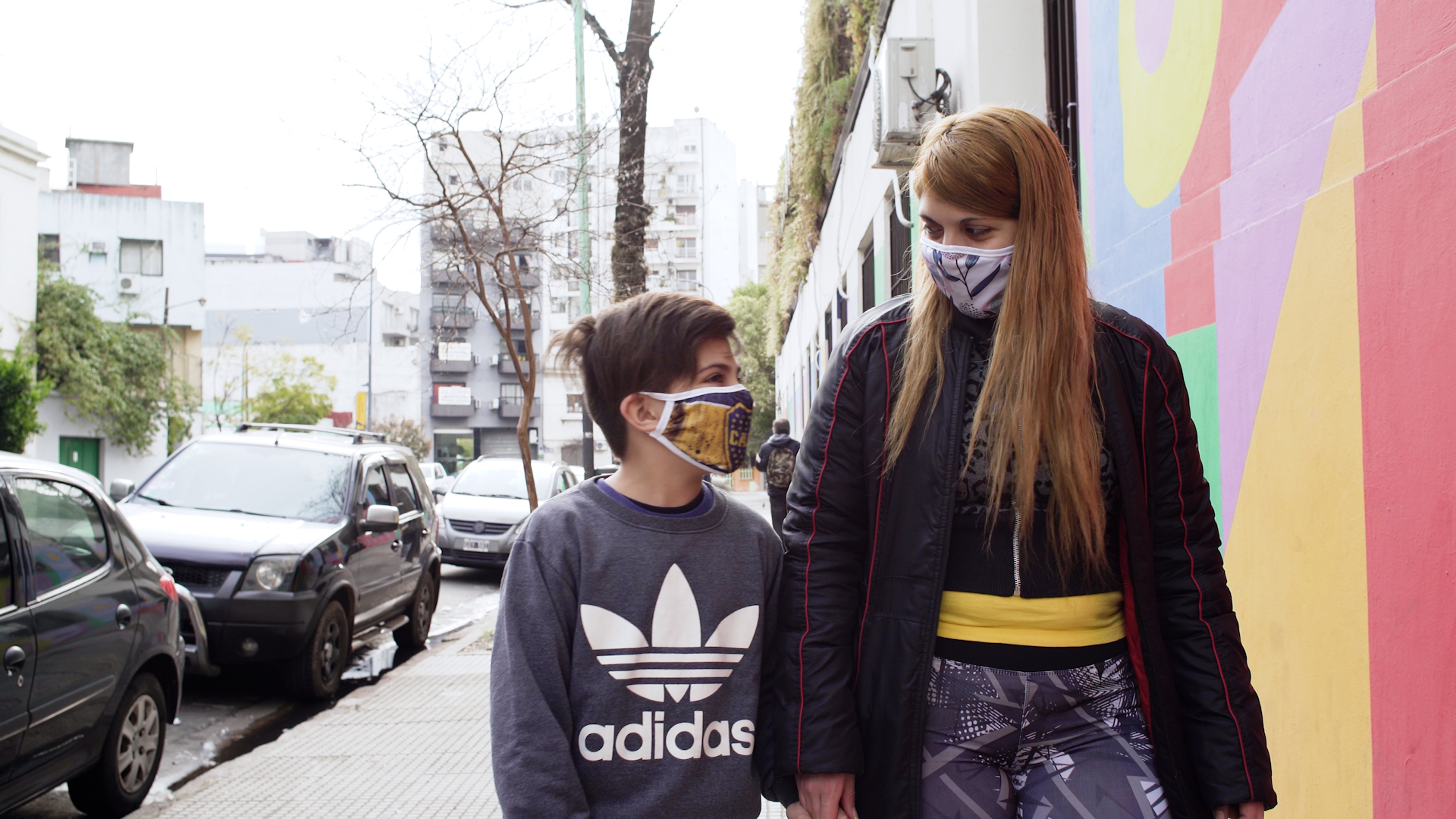 María Belén Fierro walking on the street talking to her son