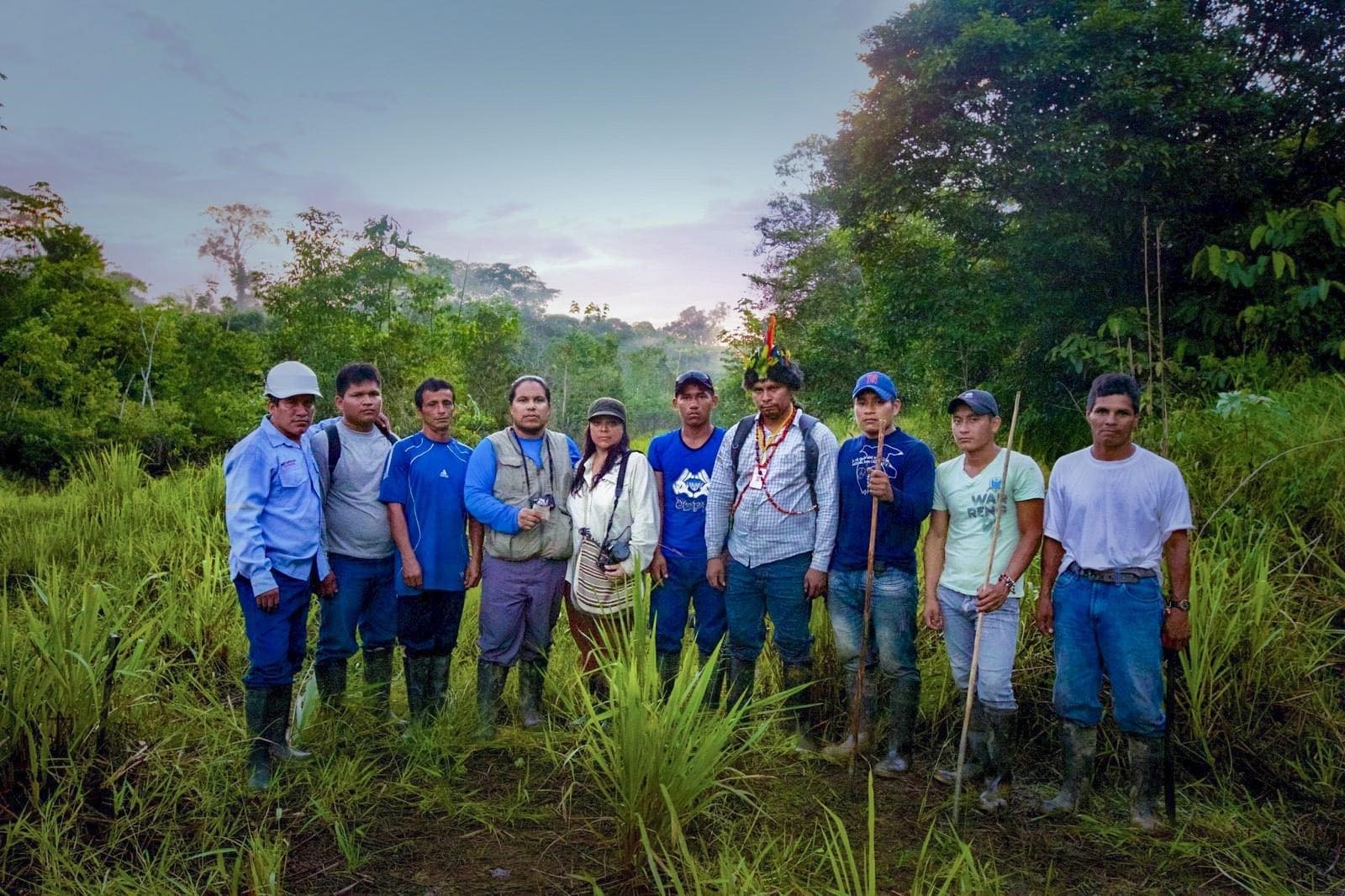 Bryan Parras poses for a group photo with other environmental justice advocates, in the Peruvian rainforest.