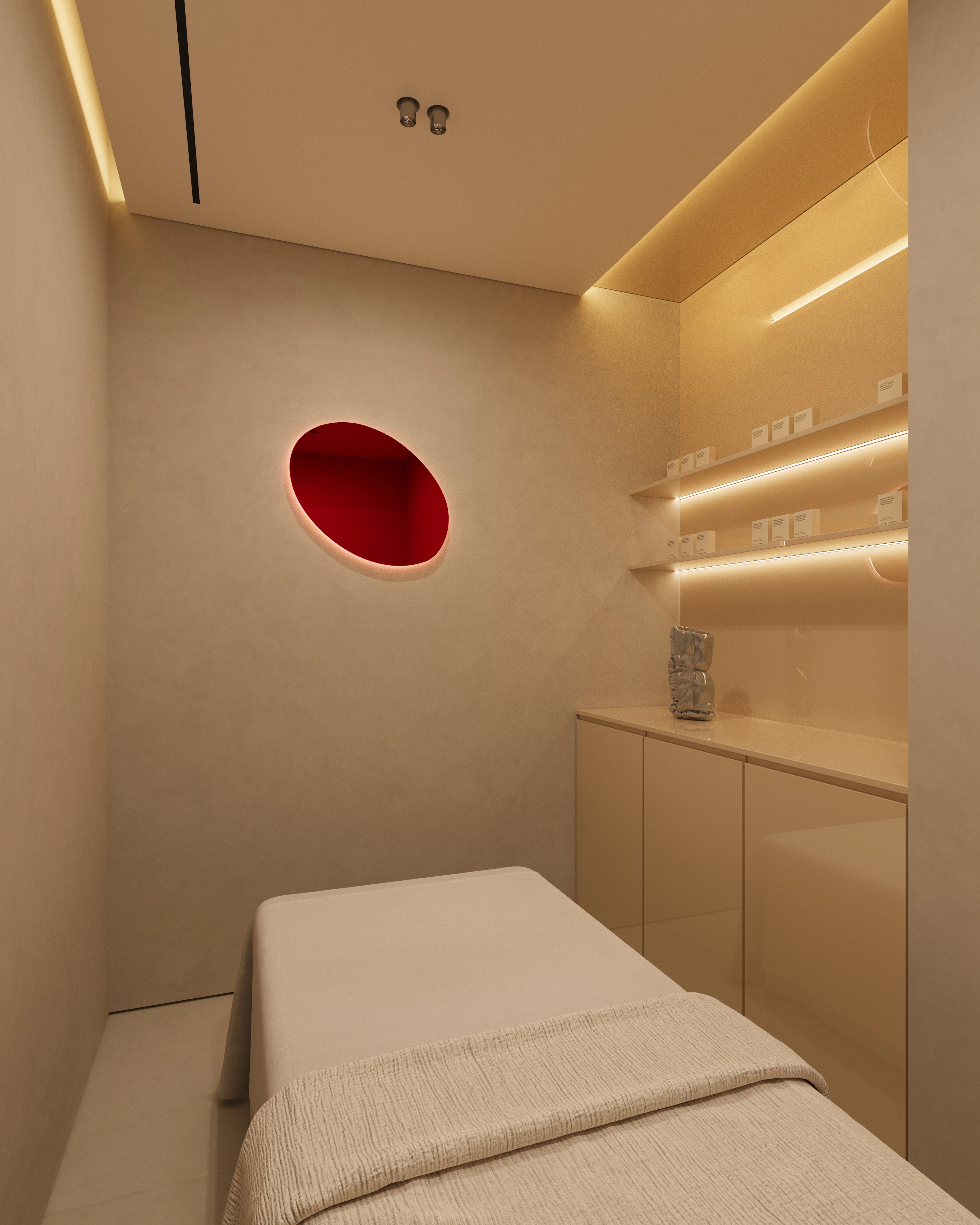 Minimal nail salon treatment room with a white treatment bed, beige walls, recessed lighting, and a red oval wall accent.