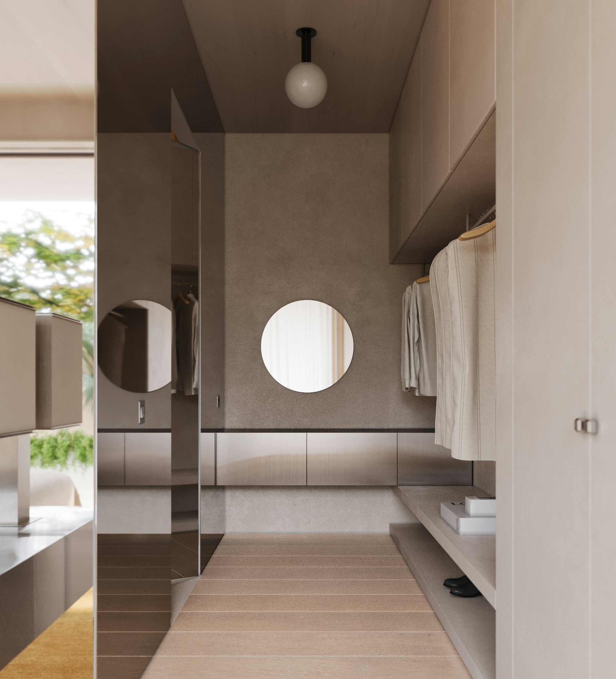 Walk-in wardrobe of master bedroom with built-in cabinetry, round mirror, and neatly arranged clothing in a soft beige interior.