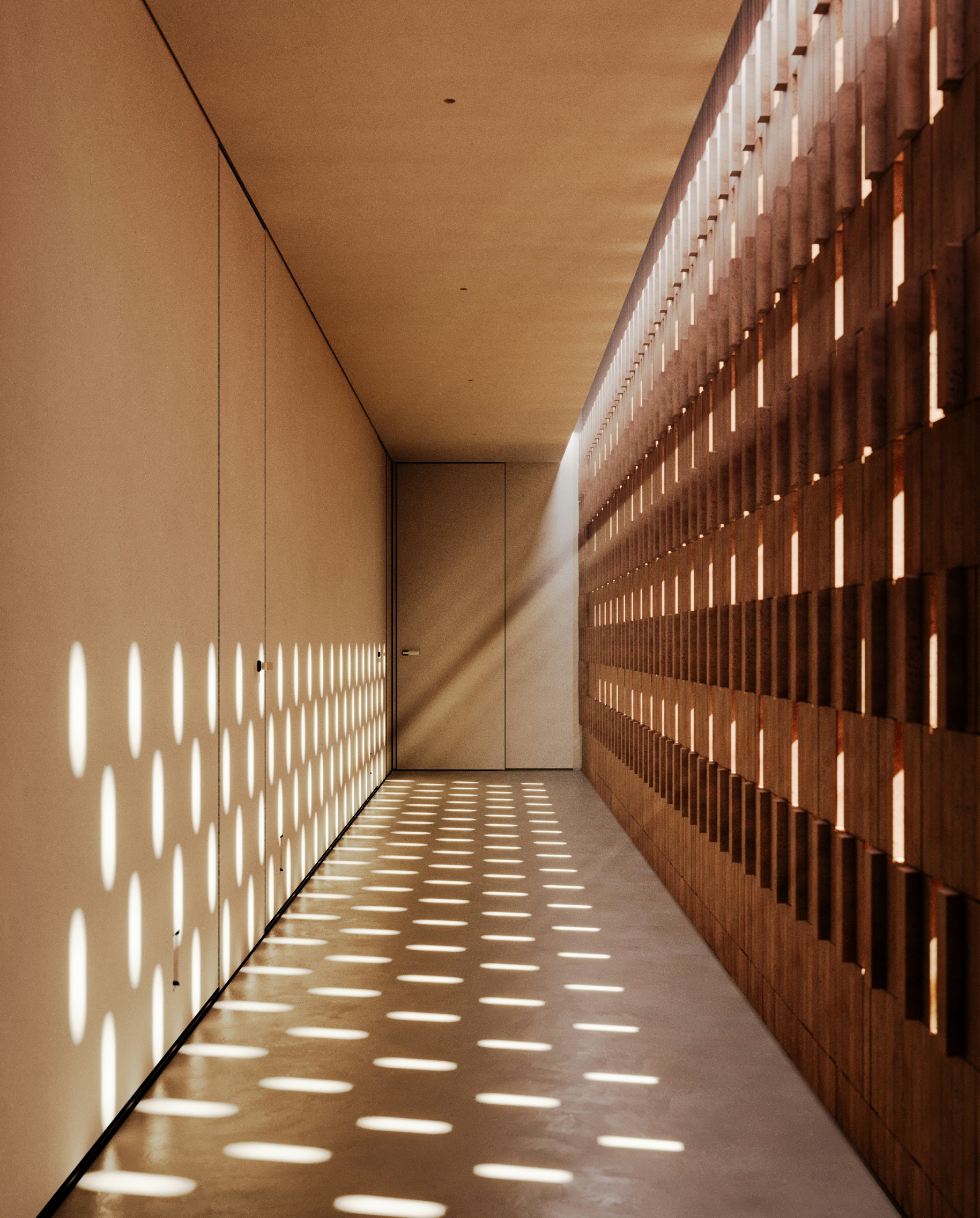 Long corridor with perforated brick wall casting patterned light across the floor.