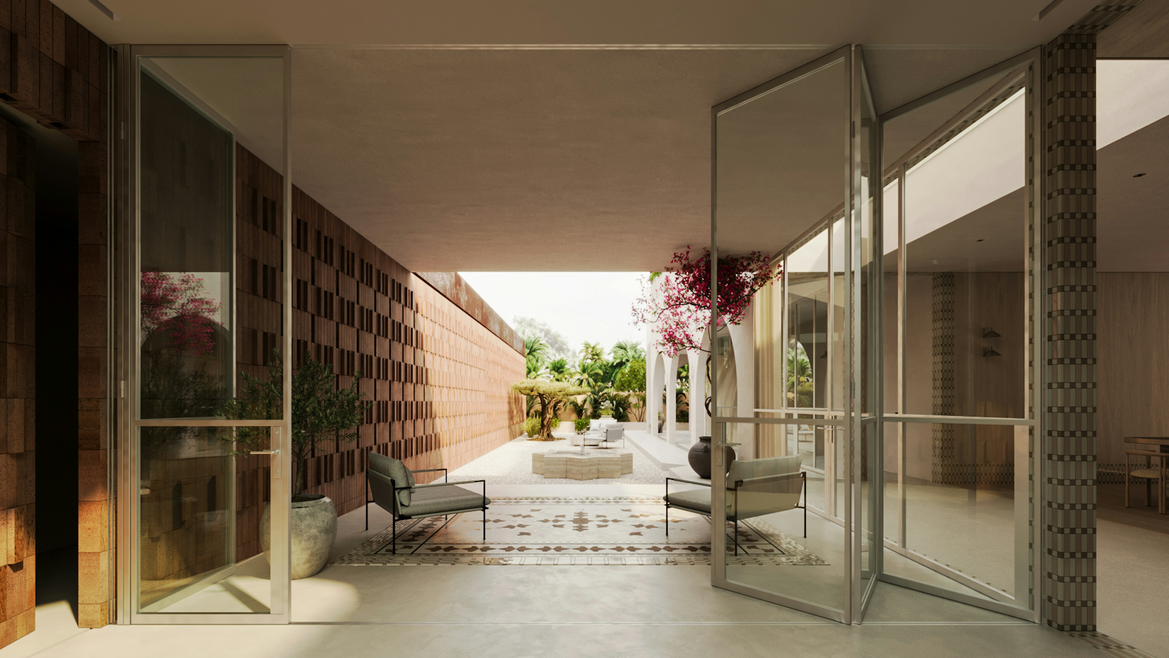 Outdoor sitting area in a courtyard with tree, stone fountain, and lounge chairs.