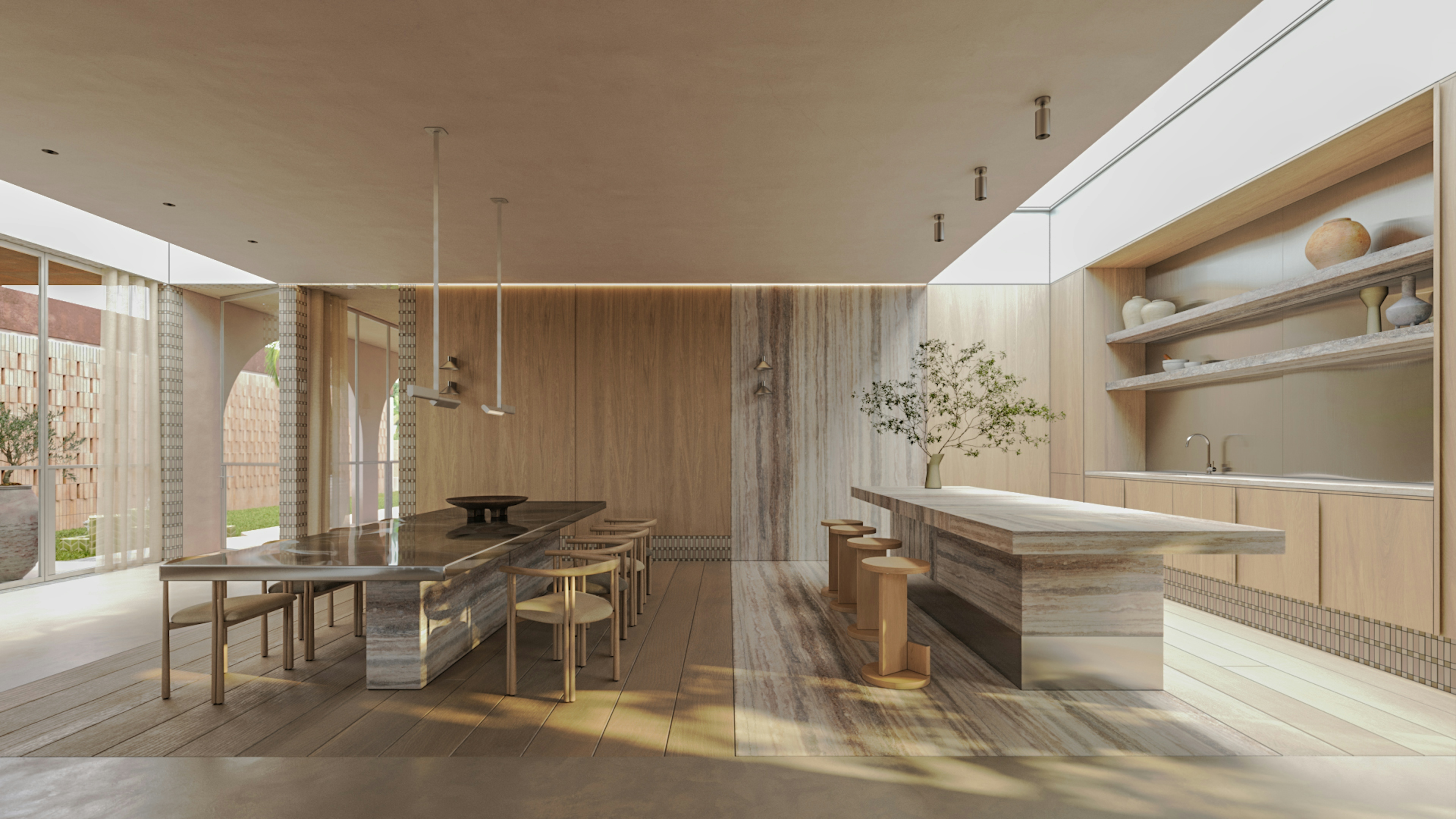 Modern open kitchen and dining space with stone island, long wooden table, and soft natural lighting.
