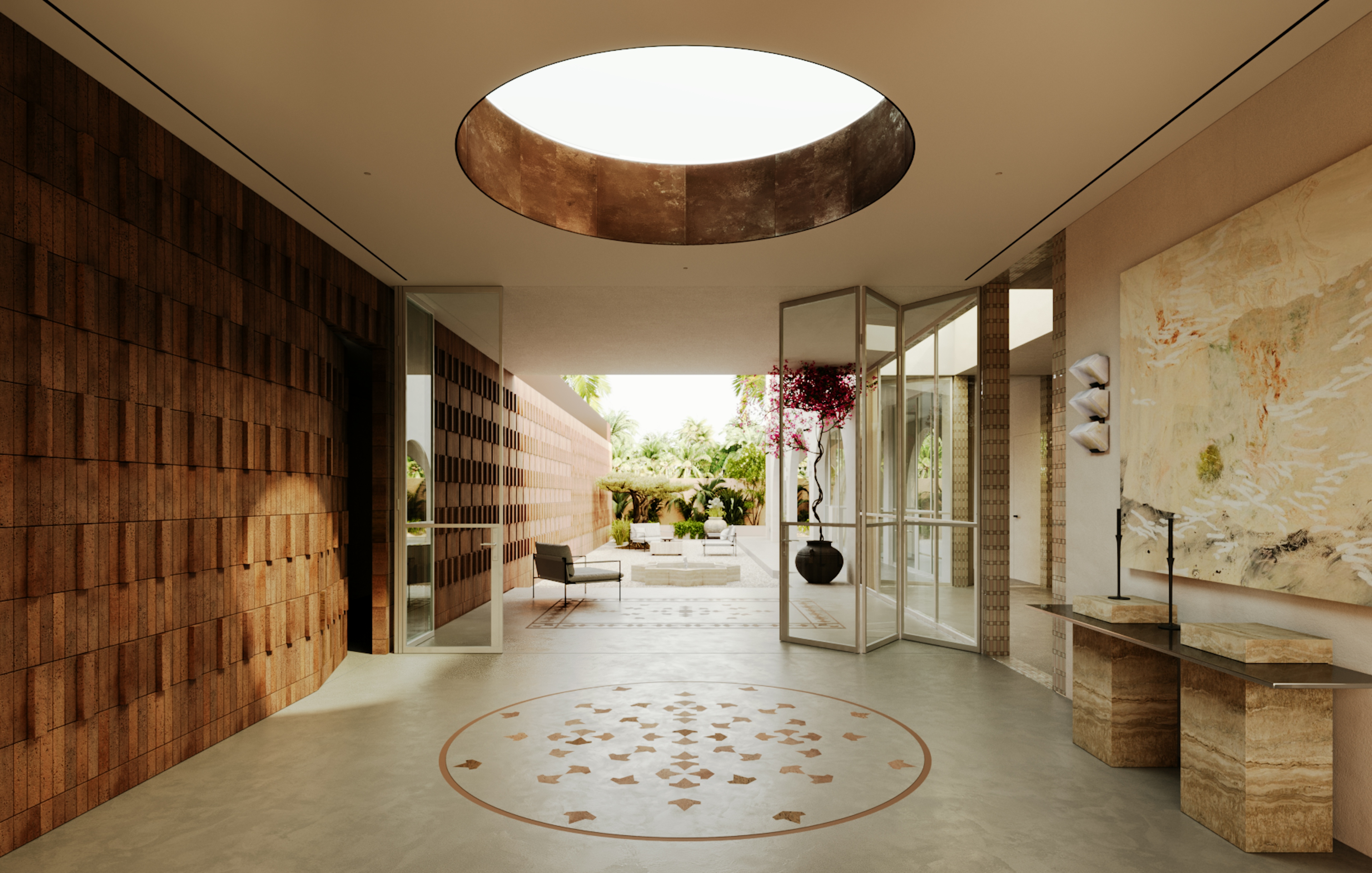 Lobby with circular skylight, patterned flooring, and view into landscaped courtyard.