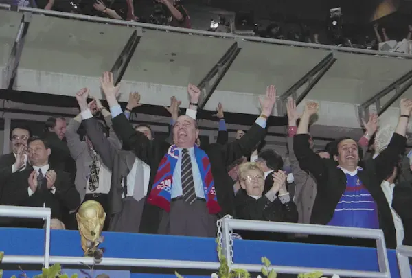 Photograph of the presidential box during the French national football team's victory over Brazil on July 12, 1998, featuring President Jacques Chirac and Michel Platini.