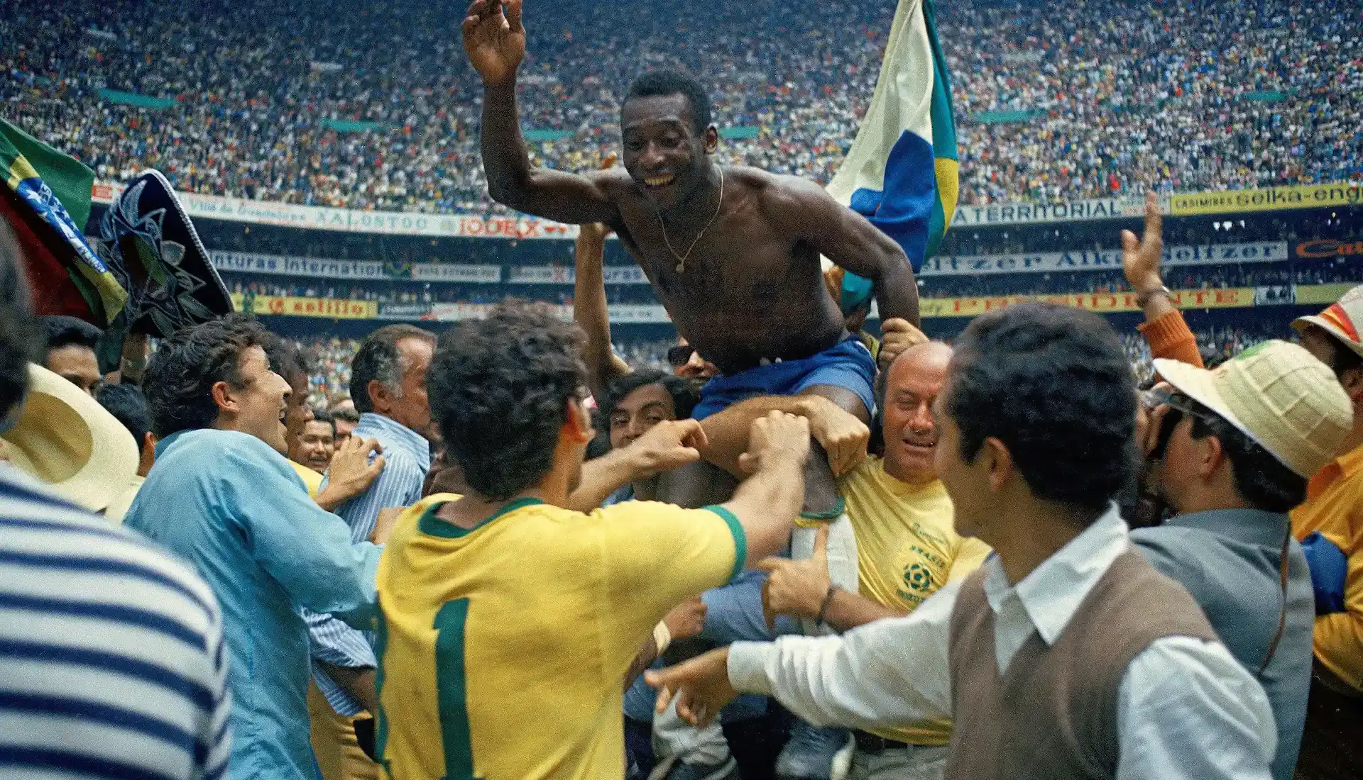 Pele celebrating World Cup win with Brazil