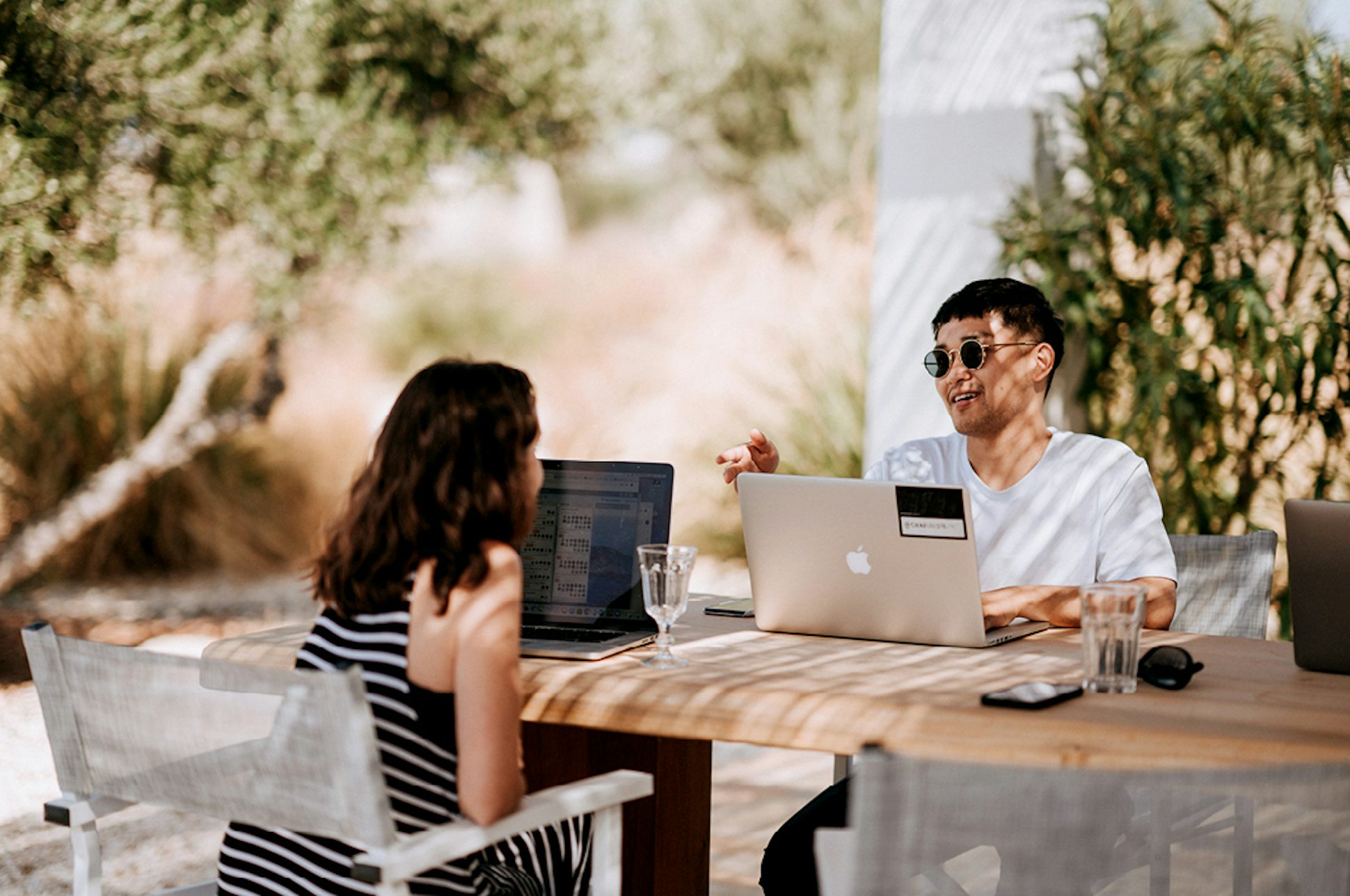 Two people chatting over laptops