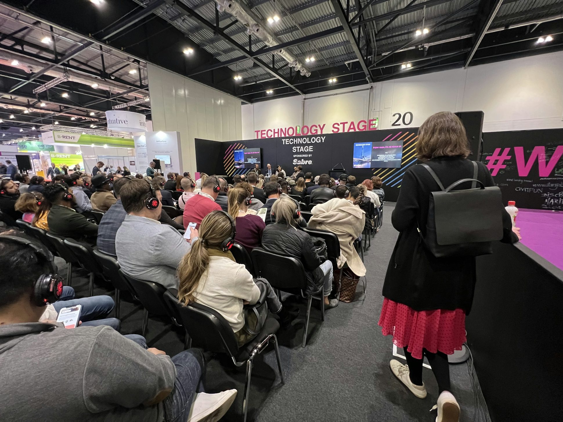A large crowd watching a panel discussion at WTM London