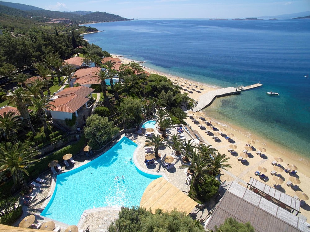 Aerial view of hotel with beach and pool