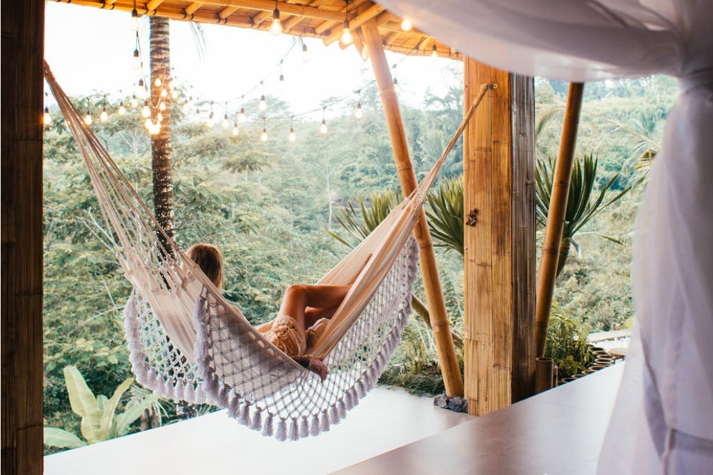 Woman lounging in a hammock