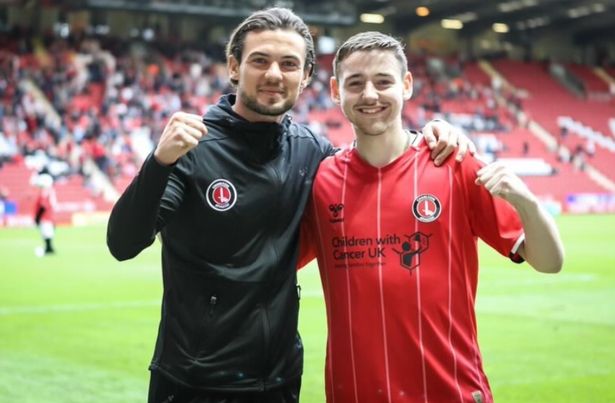 Ben in red shirt with Charlton Athletic player