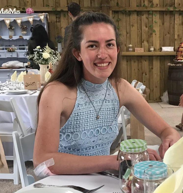 Smiling Jordan in a blue dress