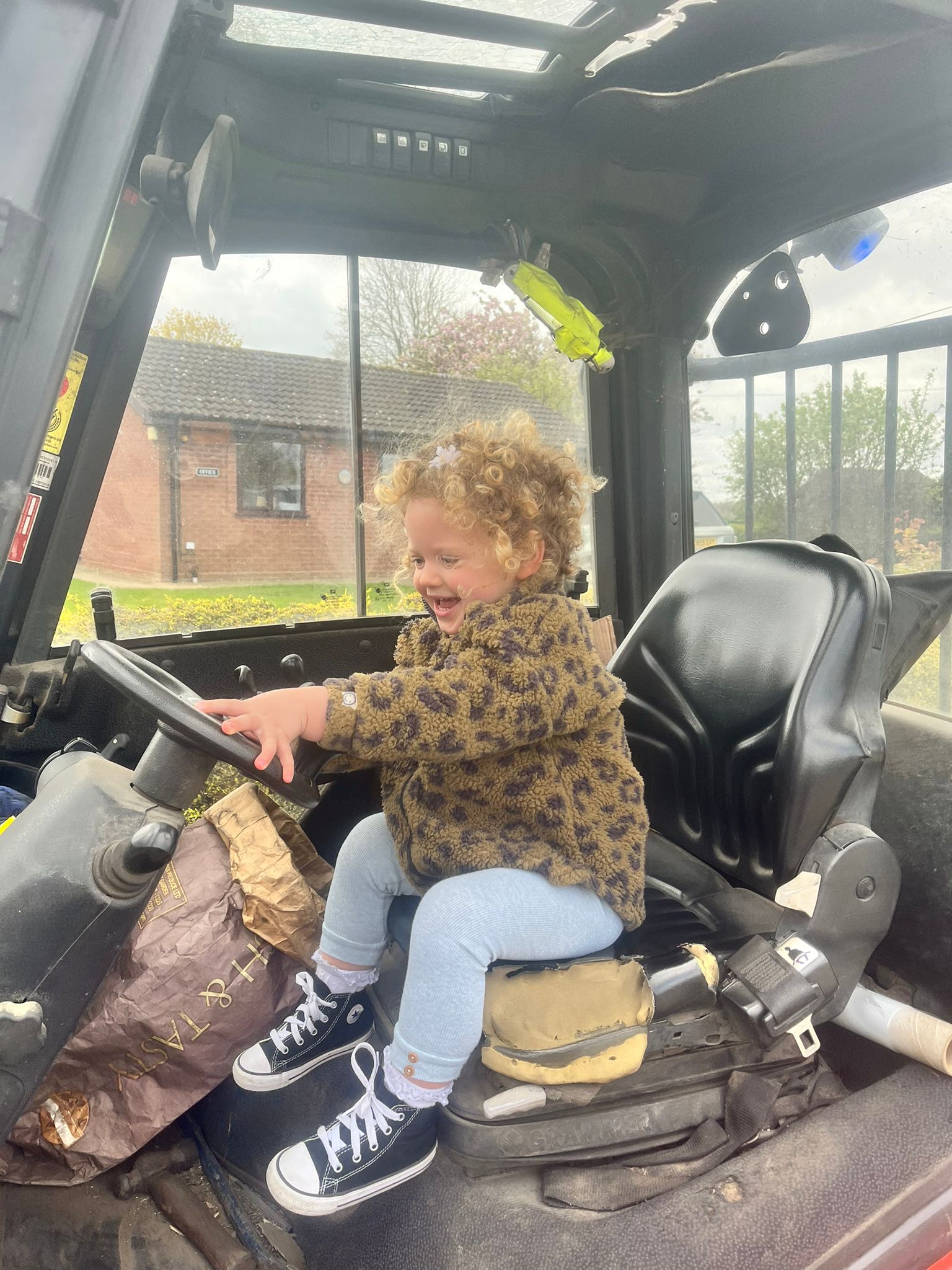 Ivy sat in the drivers seat of a truck