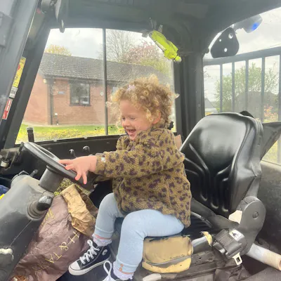 Ivy sat in the drivers seat of a truck