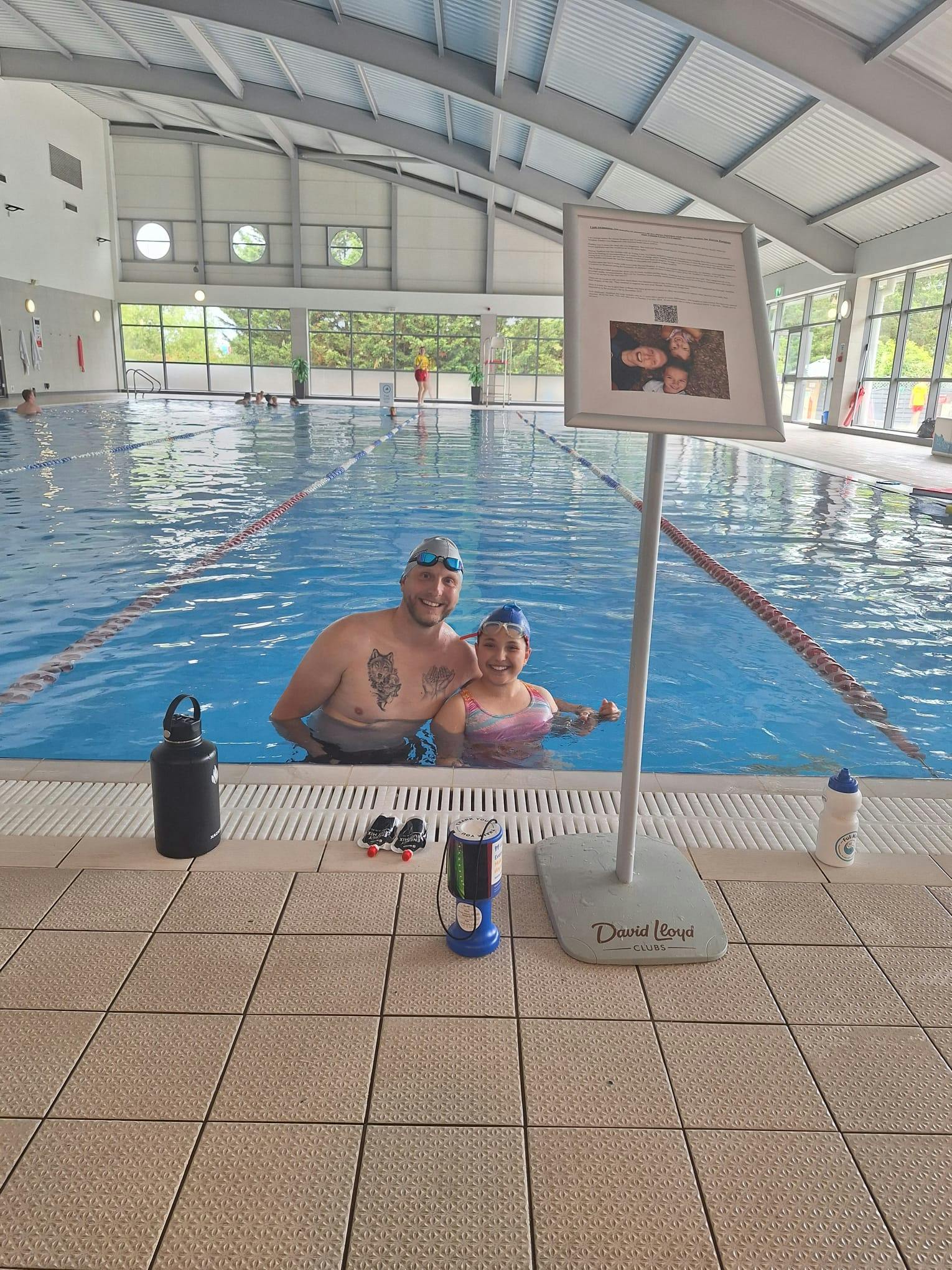 Isabella and her Dad in the swimming pool, as she completes her 5k swim