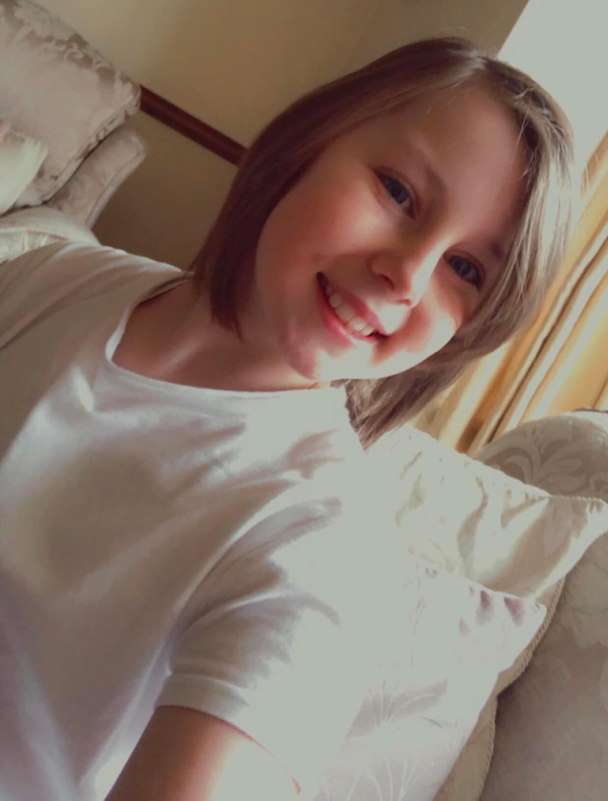 Eve Shipley, smiling and wearing a white t-shirt