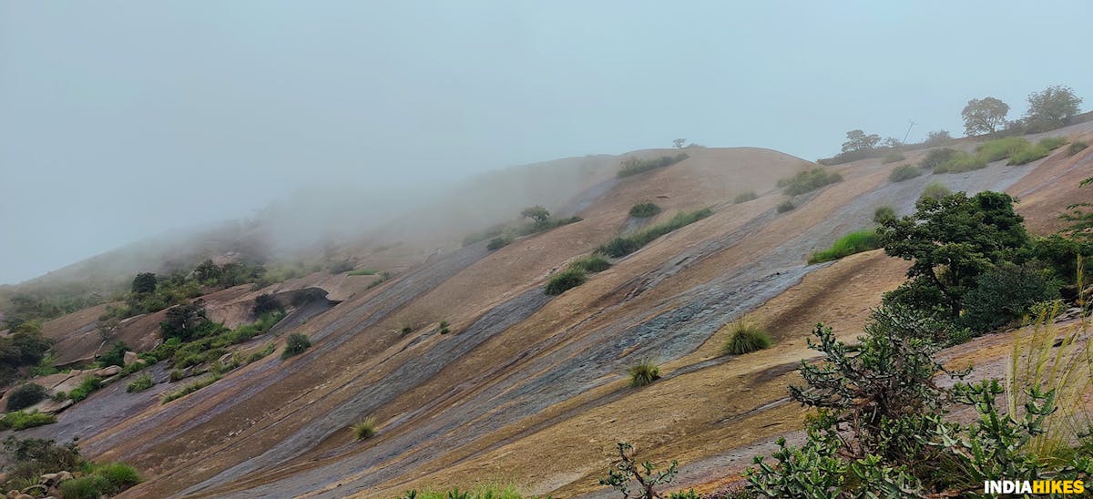 Savandurga Hills, clouds ,Treks around Bangalore, Indiahikes, treks in karnataka.