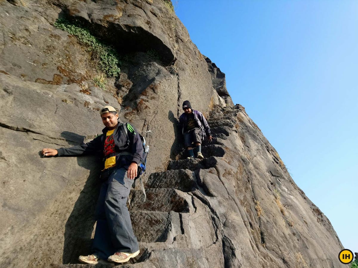AMK Trek - Trekkers descend the same set of stairs which leads to Madangad top - Indiahikes - Nitesh Kumar