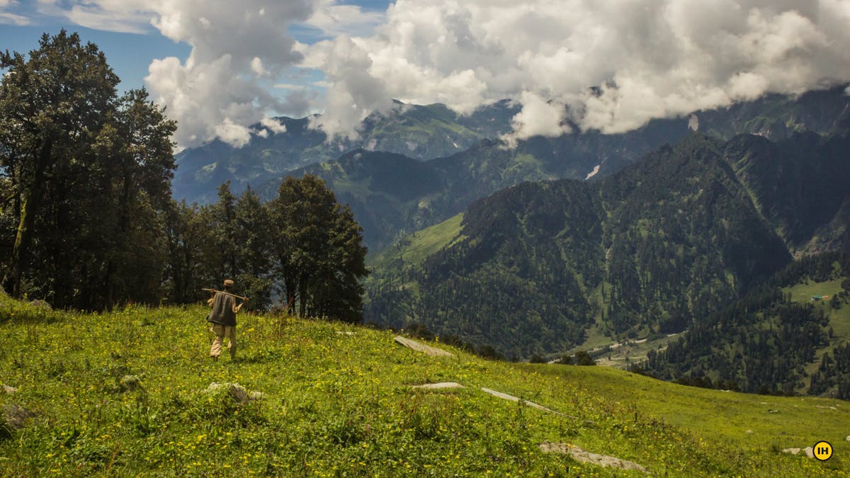 Patalsu - View of Bara Bangal Range with shepherd walking in Foreground - Indiahikes