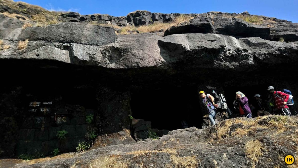 AMK Trek - Trekkers taking a break at these caves before proceeding to Madangad - Indiahikes - Nitesh Kumar
