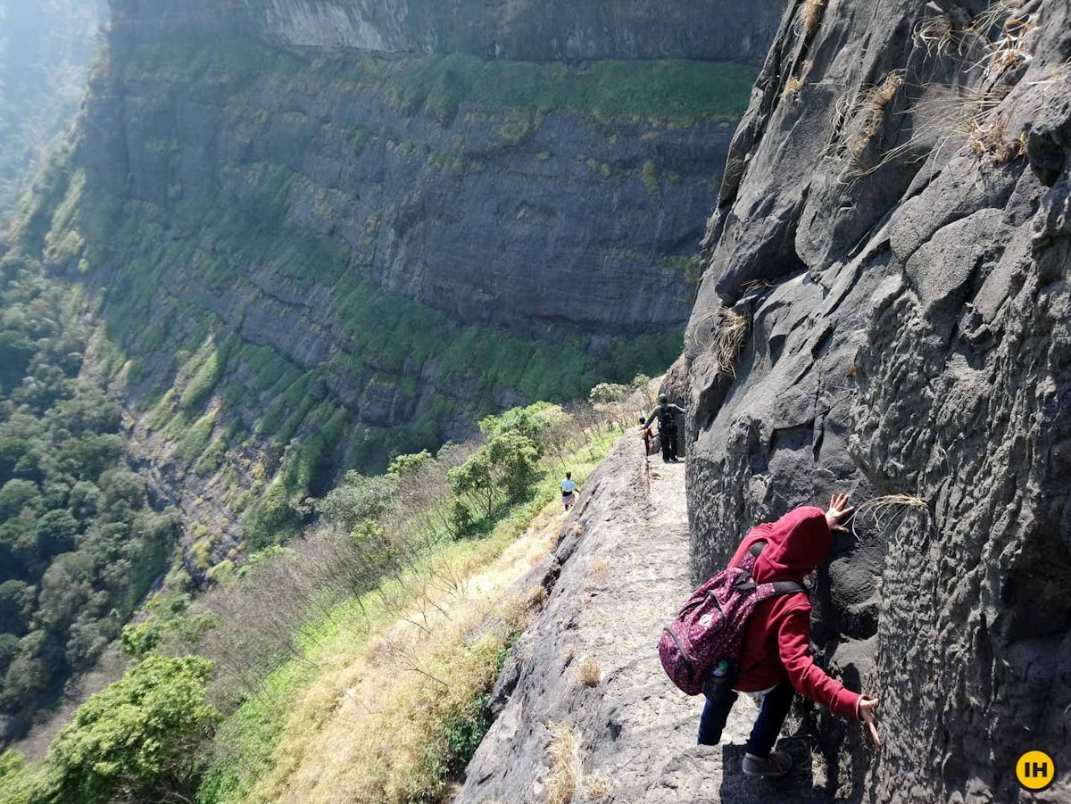 AMK Trek - Trekkers descending down the stairs. The same stairs are used to ascend to Madan fort as well - Indiahikes - Nitesh Kumar